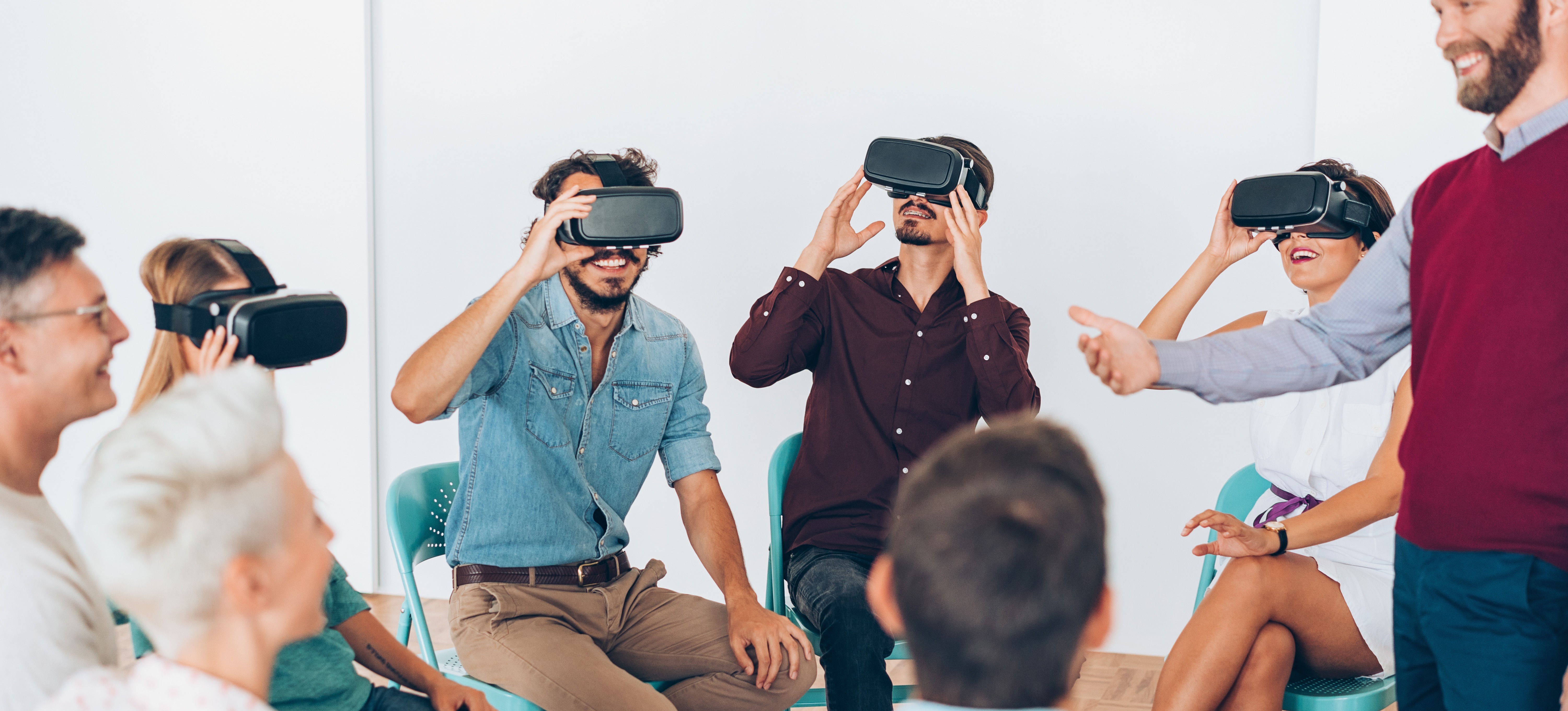 [Featured Image] A group of learners exploring the difference between artificial reality and virtual reality.
