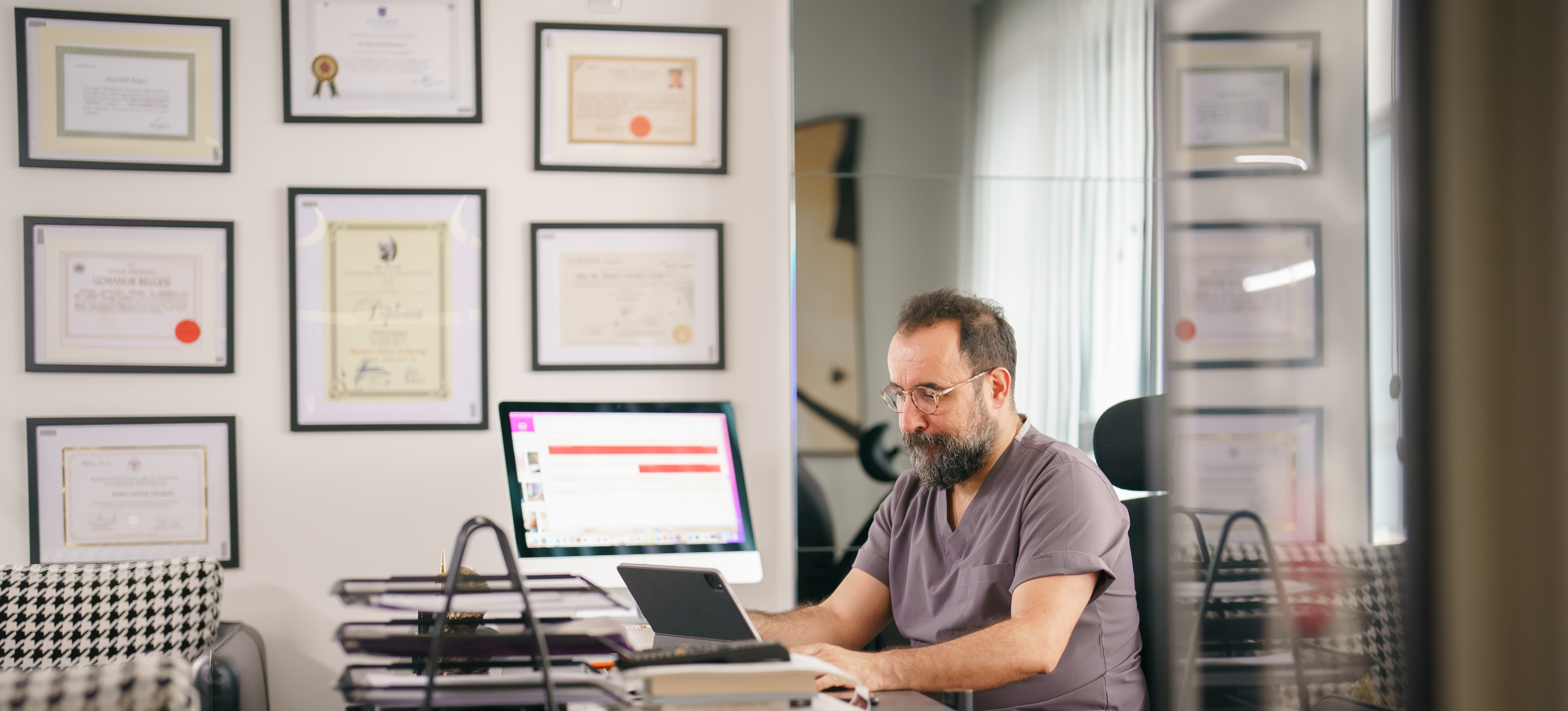 [Featured Image] A person in their home office is on their laptop, working on getting a computer science certification.