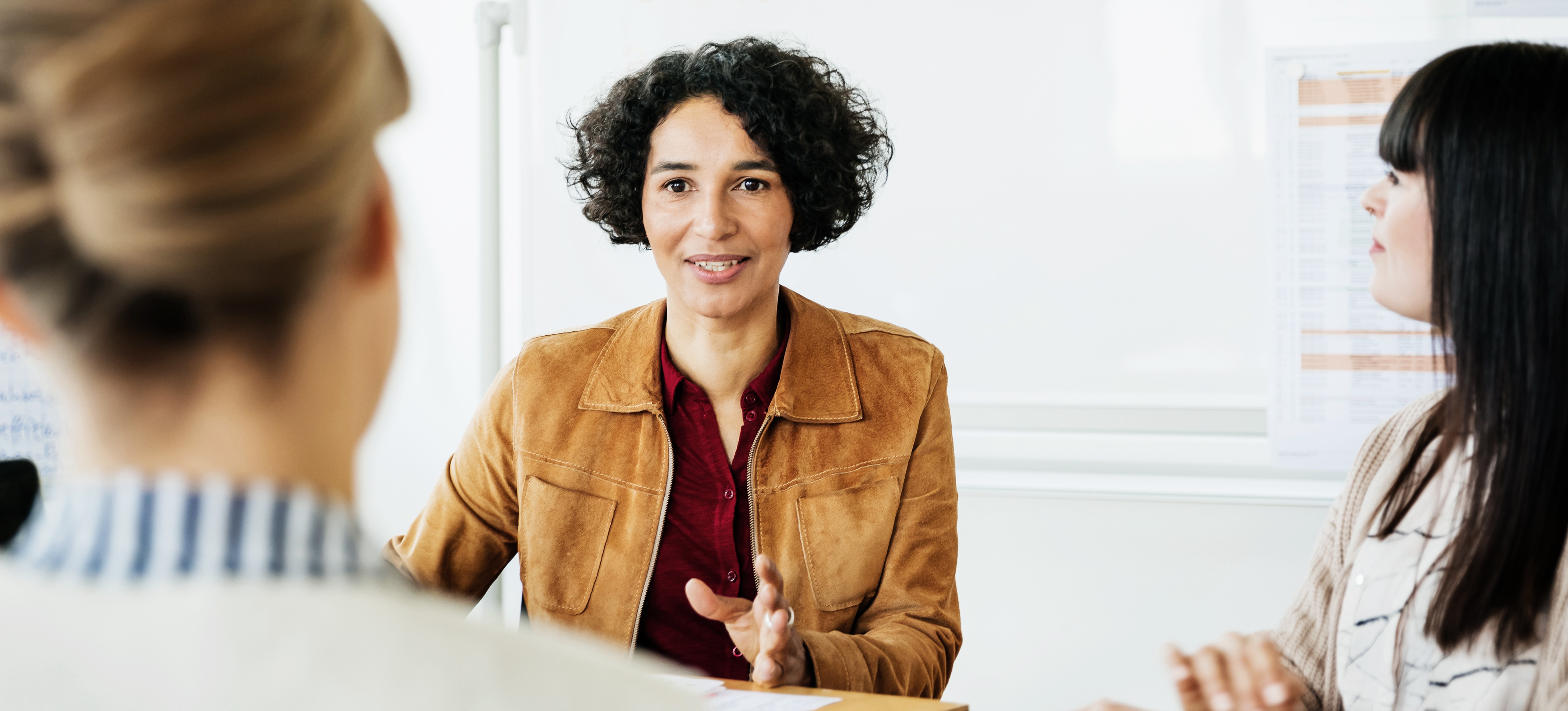 [Feature Image] Three digital marketing professionals study together as they prepare for PCM certification from the American Marketing Association.
