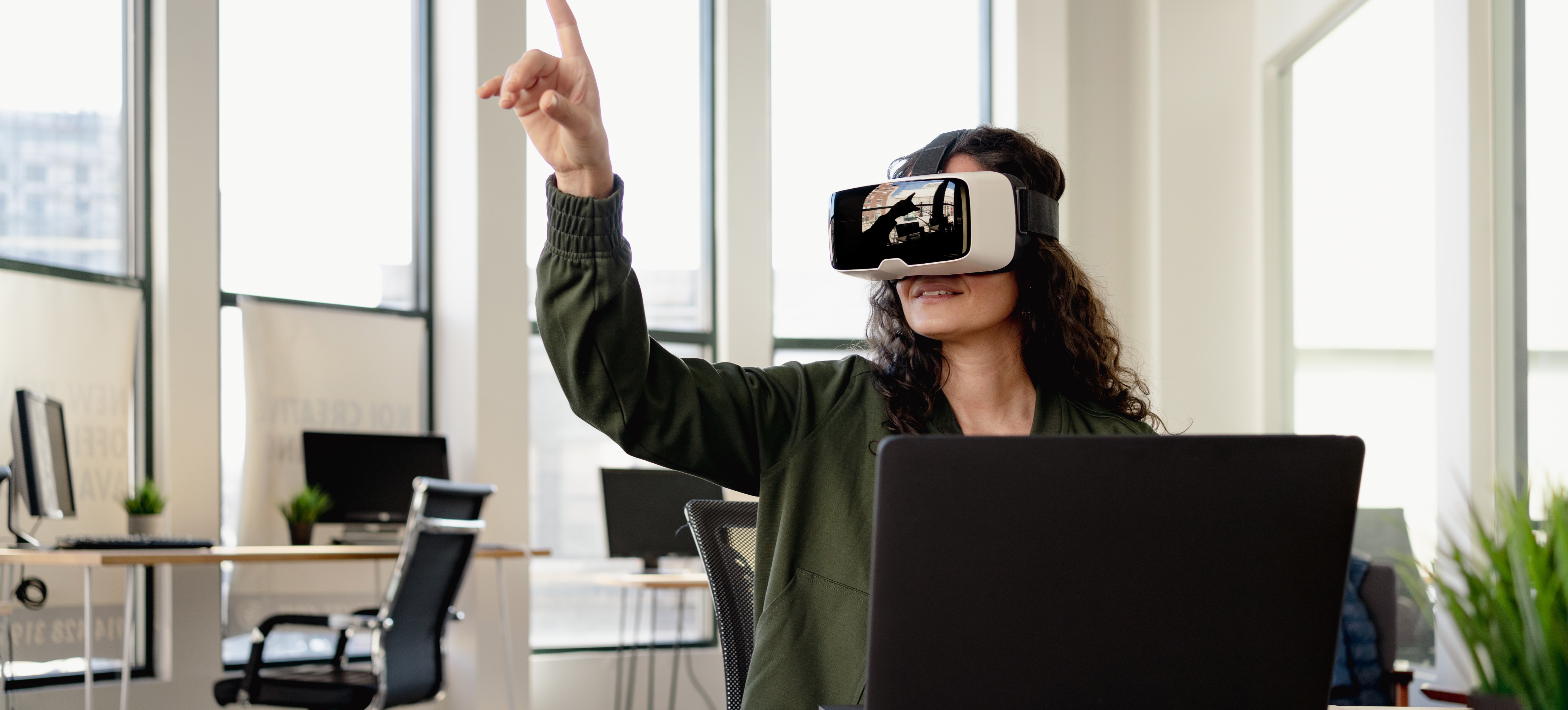 [Featured Image]: A metaverse consultant analyzes a company’s presence in the metaverse to determine methods for improving it.
