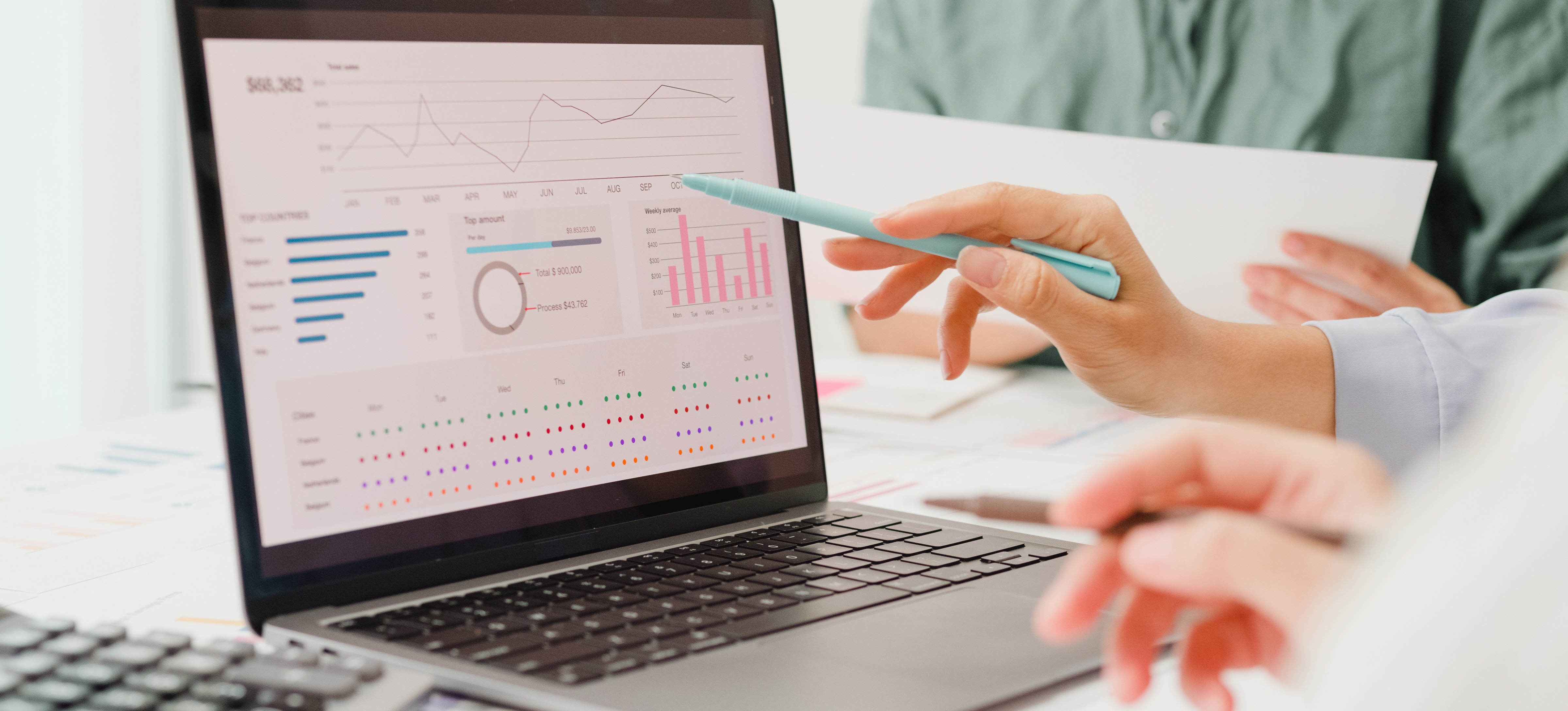 [Featured Image] A data analyst looks at a dashboard on her laptop to keep track of live data.
