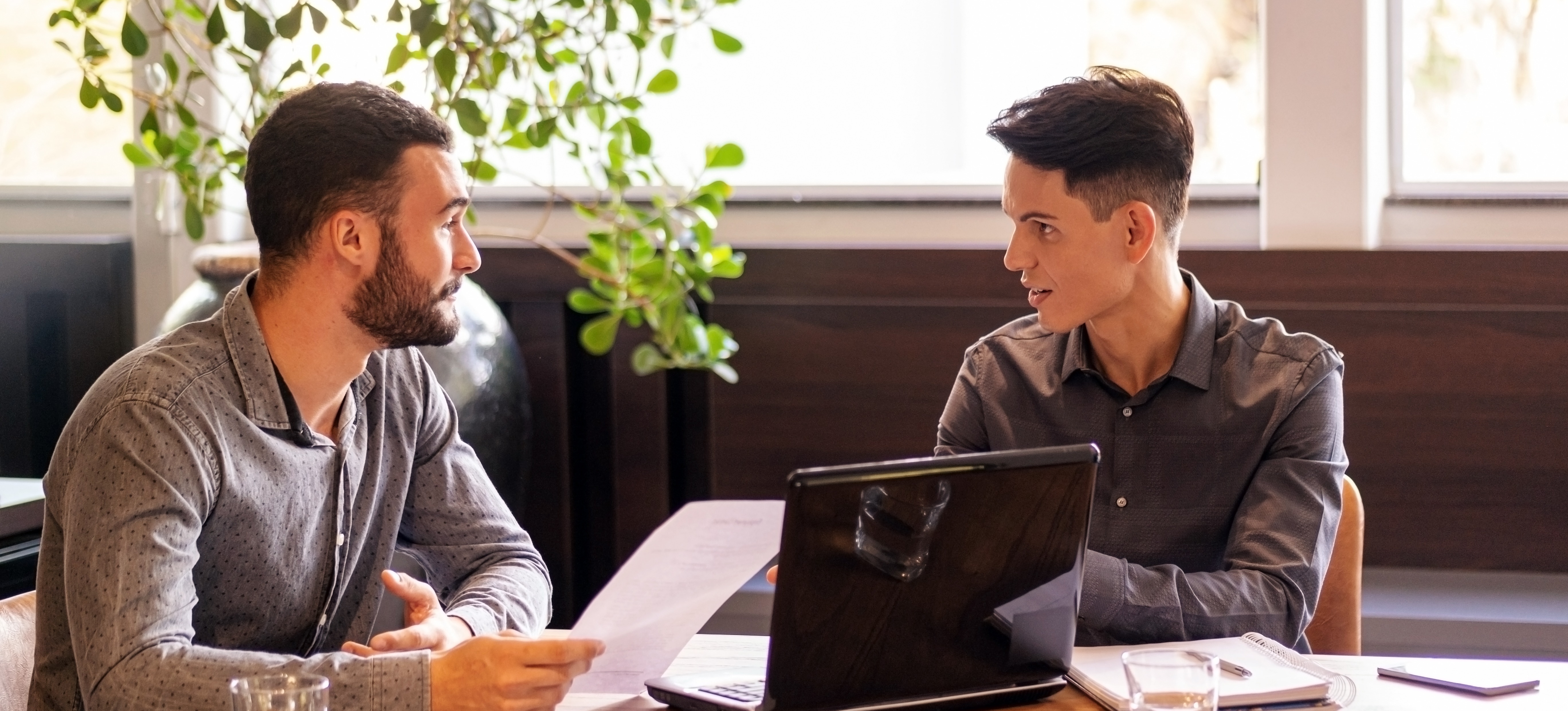 [Featured Image] A person sits in a comfortable office, conducting a data scientist interview with a candidate.
