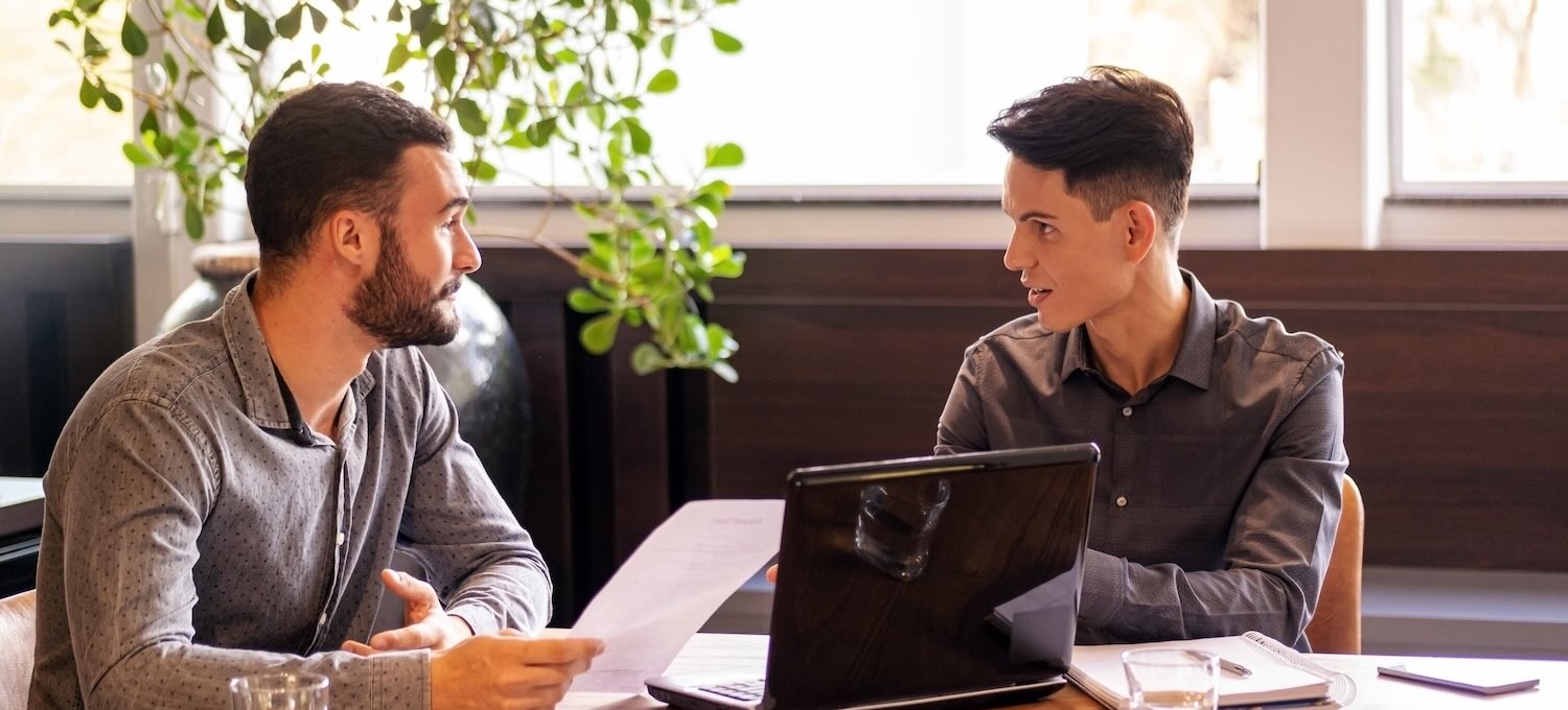 [Featured Image] A person sits in a comfortable office, conducting a data scientist interview with a candidate.
