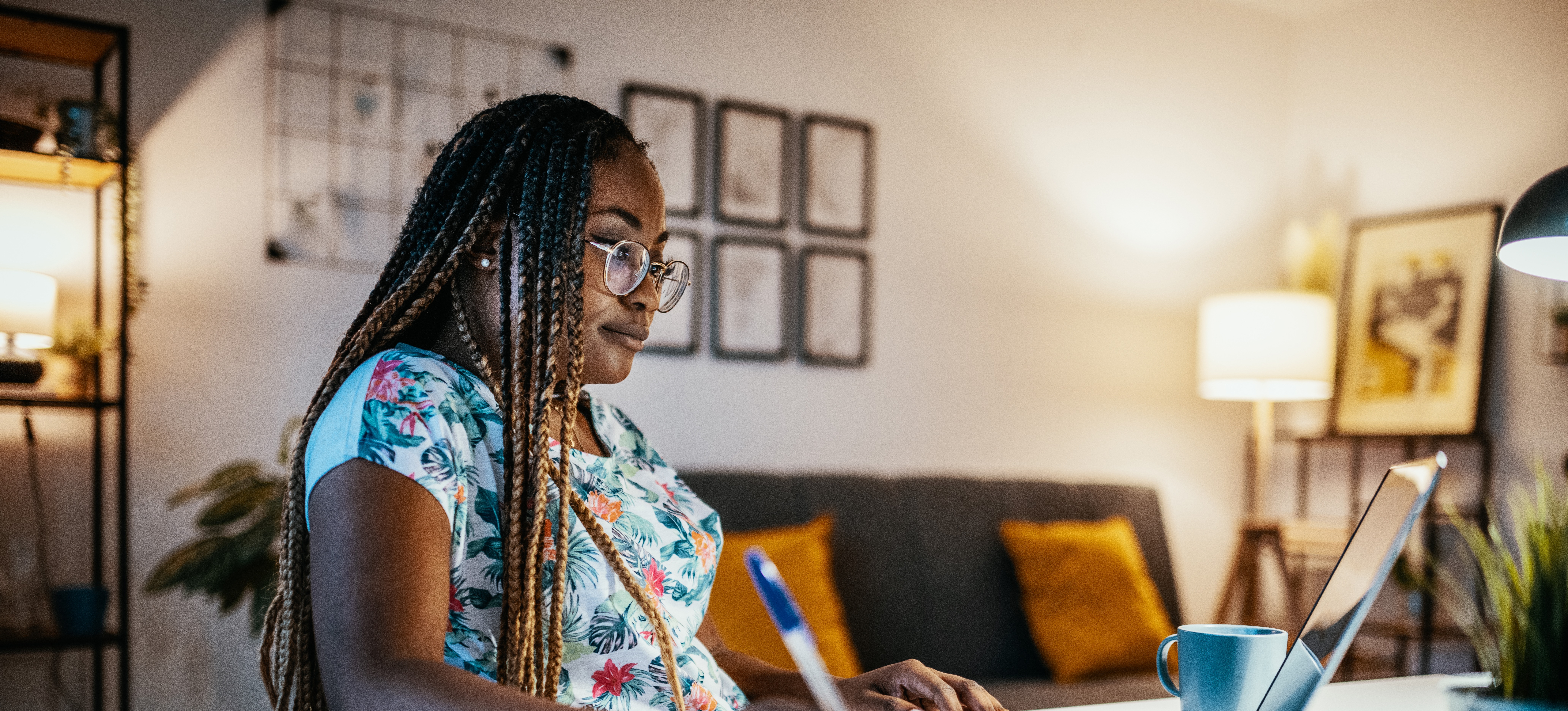 [Featured Image]:  A candidate for a project management degree works on coursework. 