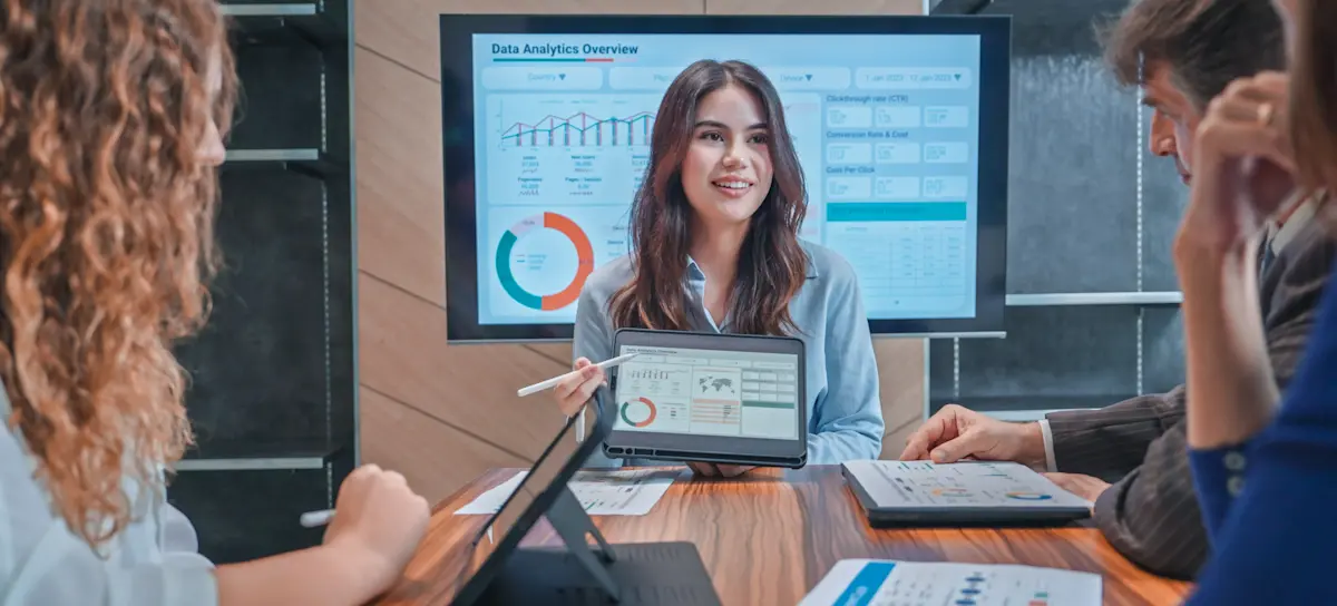 [Featured image]: A data analyst explains what is a linear association in the data as they present to a group.
