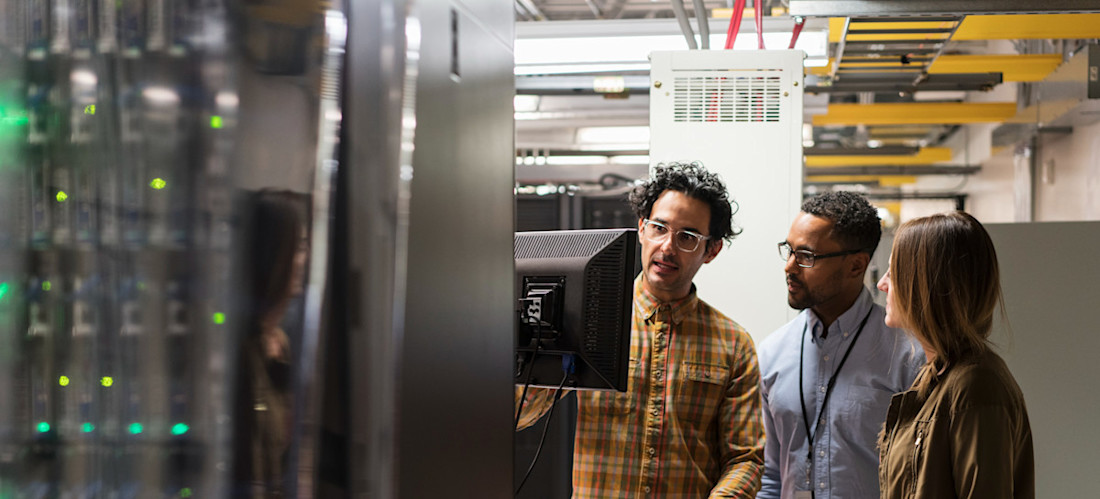 [Featured Image]: QA tester, working with the team reviewing quality standards while developing the latest product. 