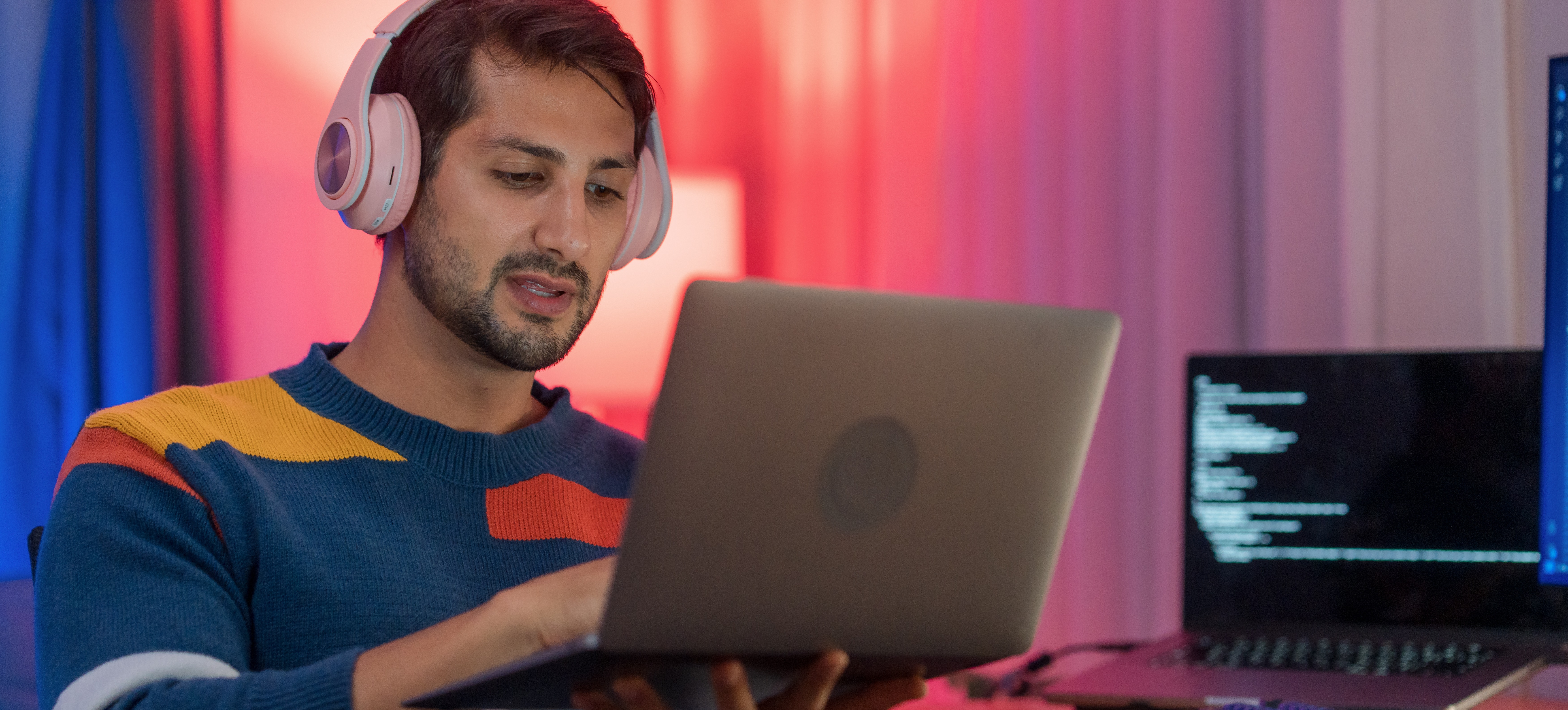 [Featured Image] An AI engineer works on a laptop, using neural network weights to train AI.
