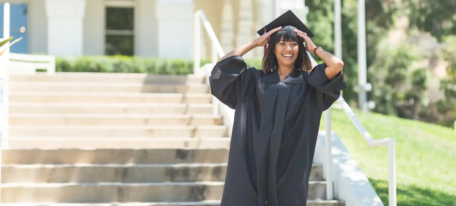 [Feature Image] A learner graduates with an early childhood education degree and prepares for their career path moving forward.
