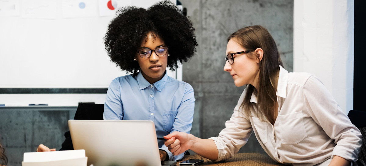 [Featured Image] Two computer science learners discuss Python concepts as part of their studies.

