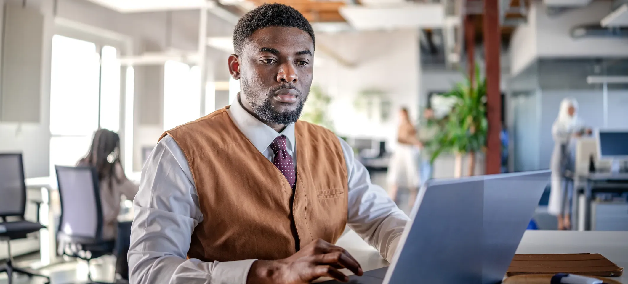 [Featured Image] A data professional uses INDEX MATCH in Excel to look up data in a spreadsheet on their laptop. 
