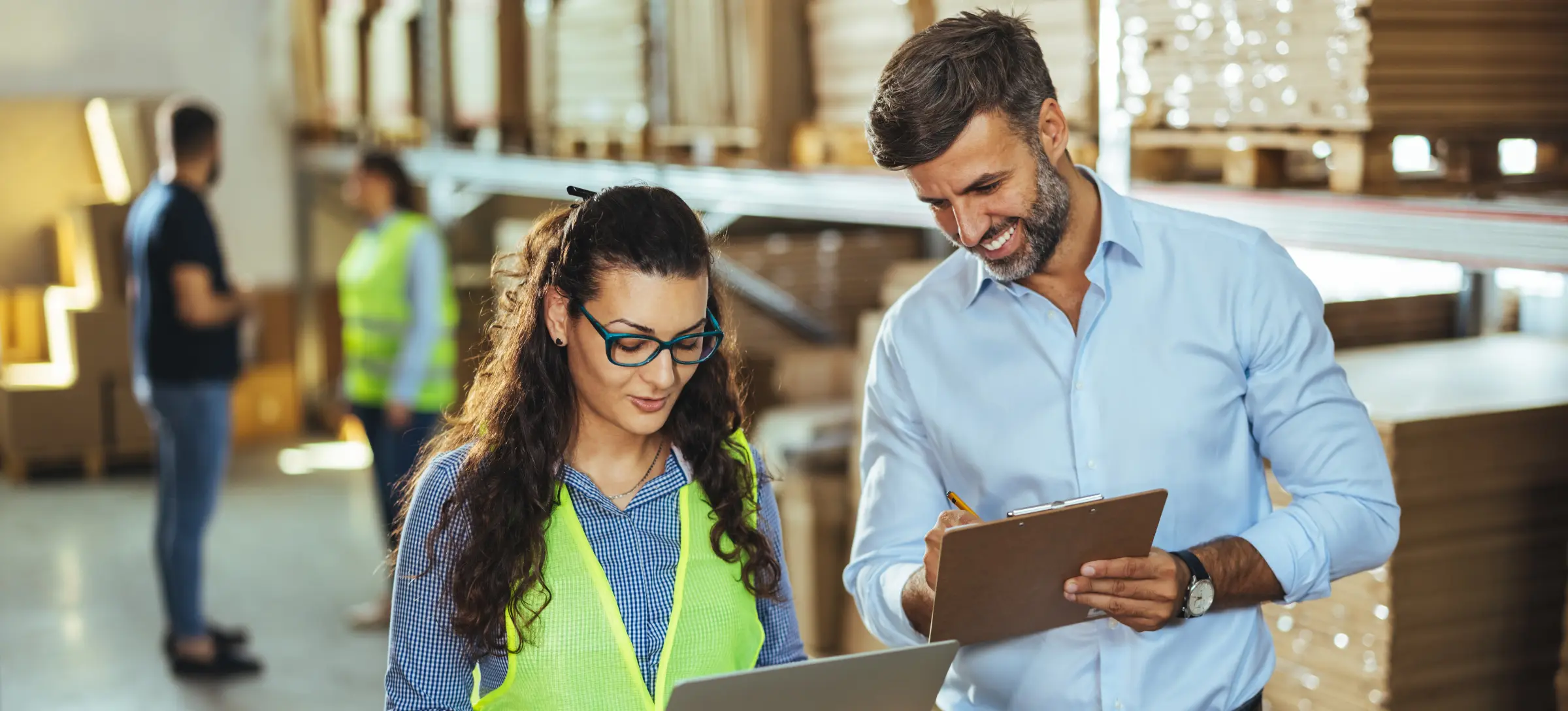 [Featured Image] A sales operations analyst is recieving the results of a recent sales strategy from a co-worker.