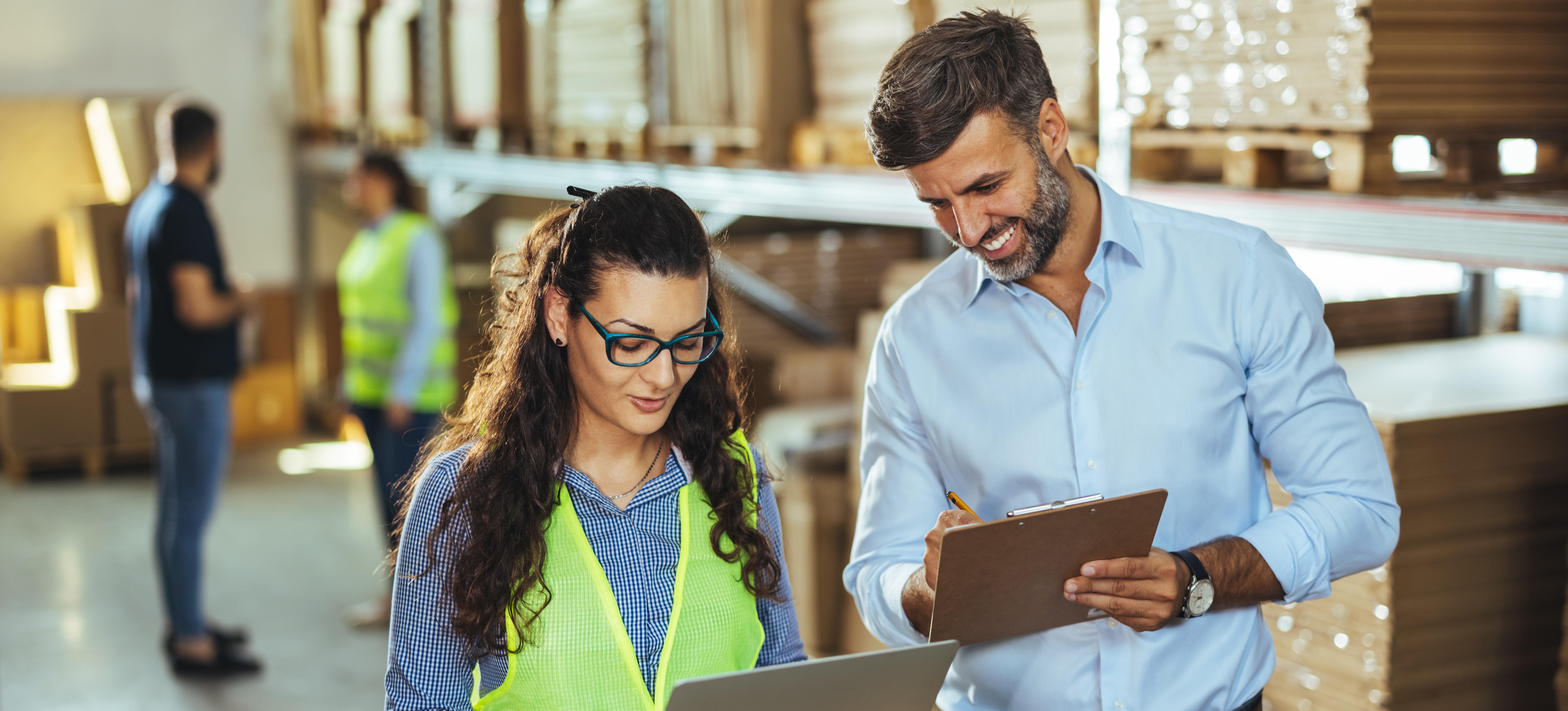[Featured Image] A sales operations analyst is recieving the results of a recent sales strategy from a co-worker.