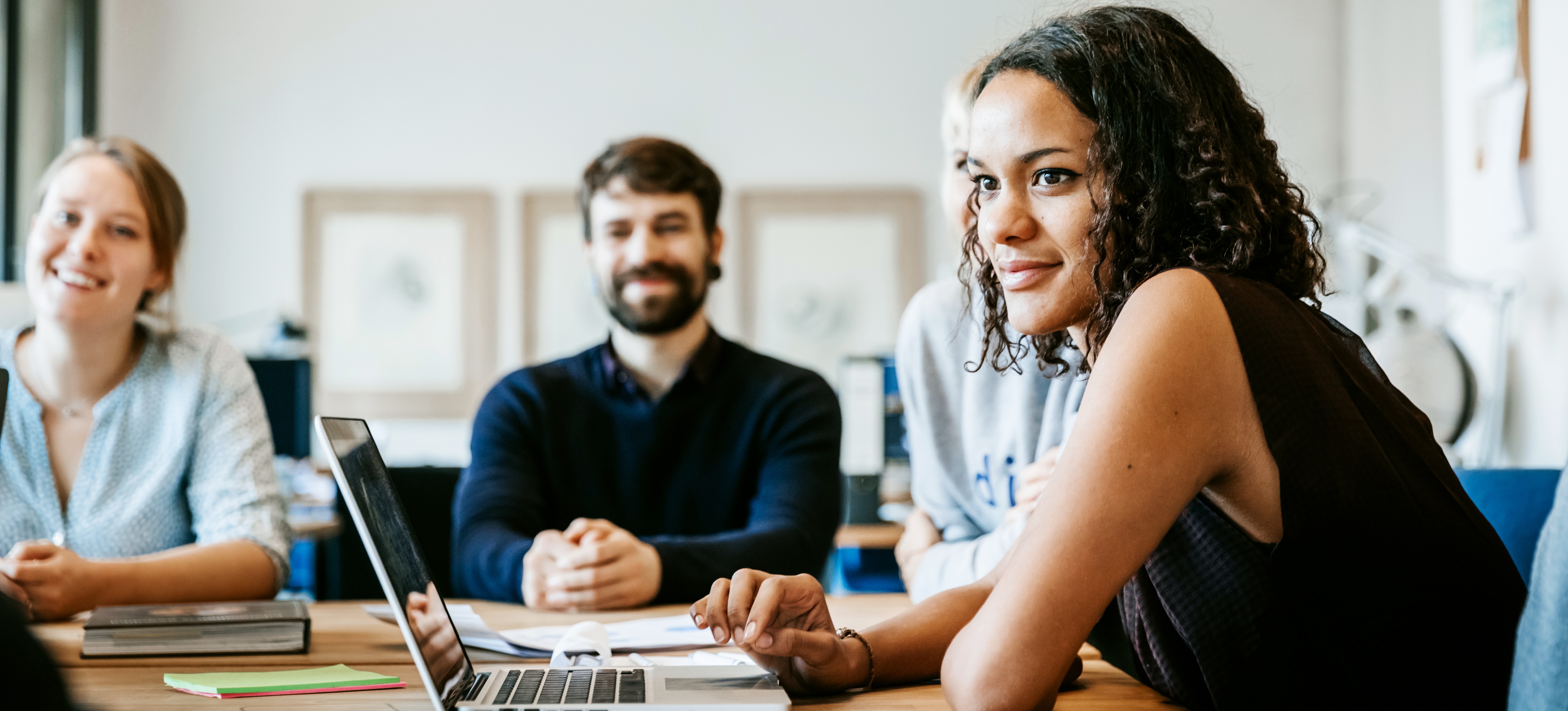 [Feature Image] Learners listen to an instructor explain Node.js vs. Django in detail as part of their web development course curriculum. 