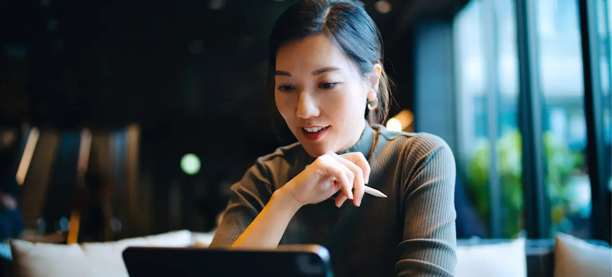 [Featured Image] A web professional researches how to use AI when project managing a website before choosing AI tools to implement for their next project.