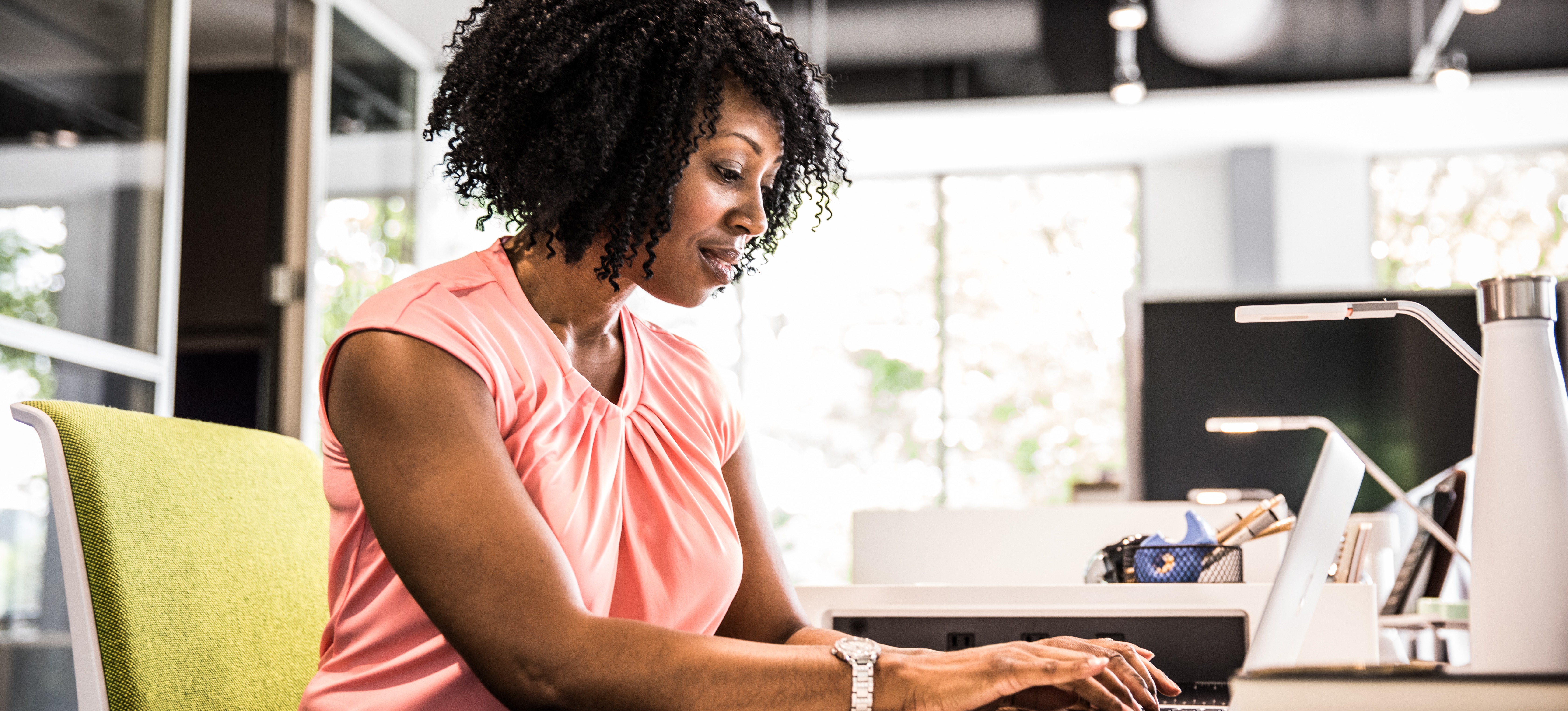 [Featured Image] A database administrator sits at a computer in an office and uses Db2.