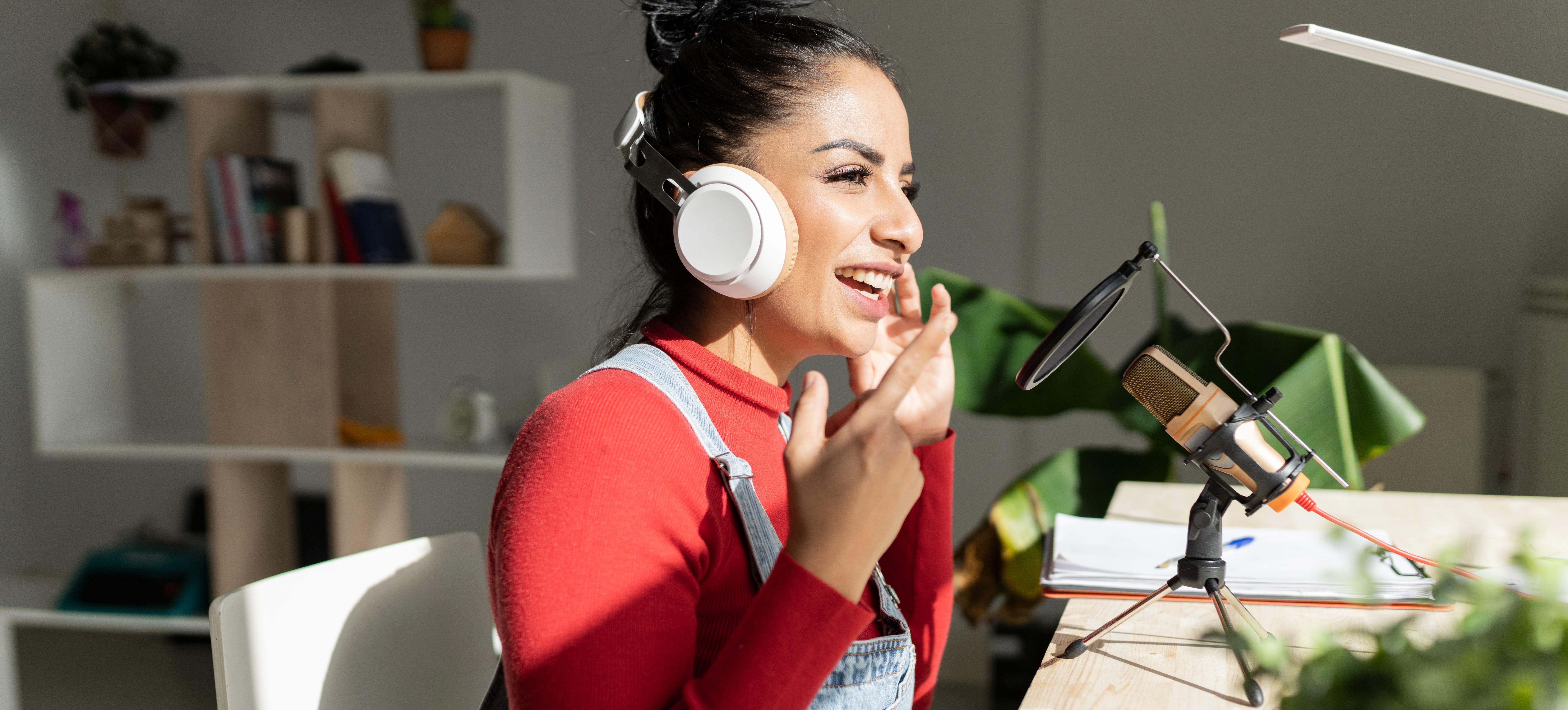 [Featured image] A podcaster reviews a product on their show, an example of earned media for the company they're promoting.