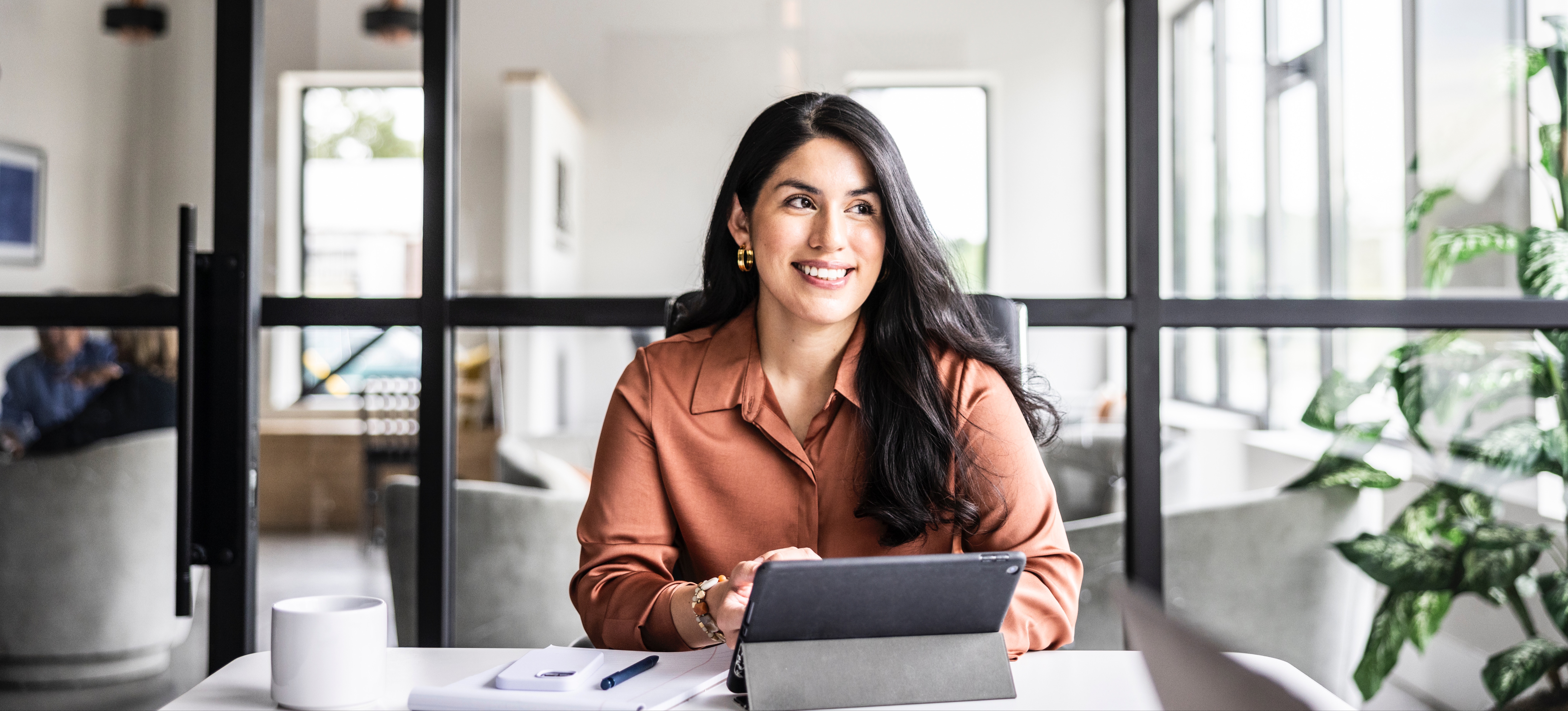 [Featured Image] A young professional researches “What is a graduate degree” on a laptop while planning their career strategy. 
