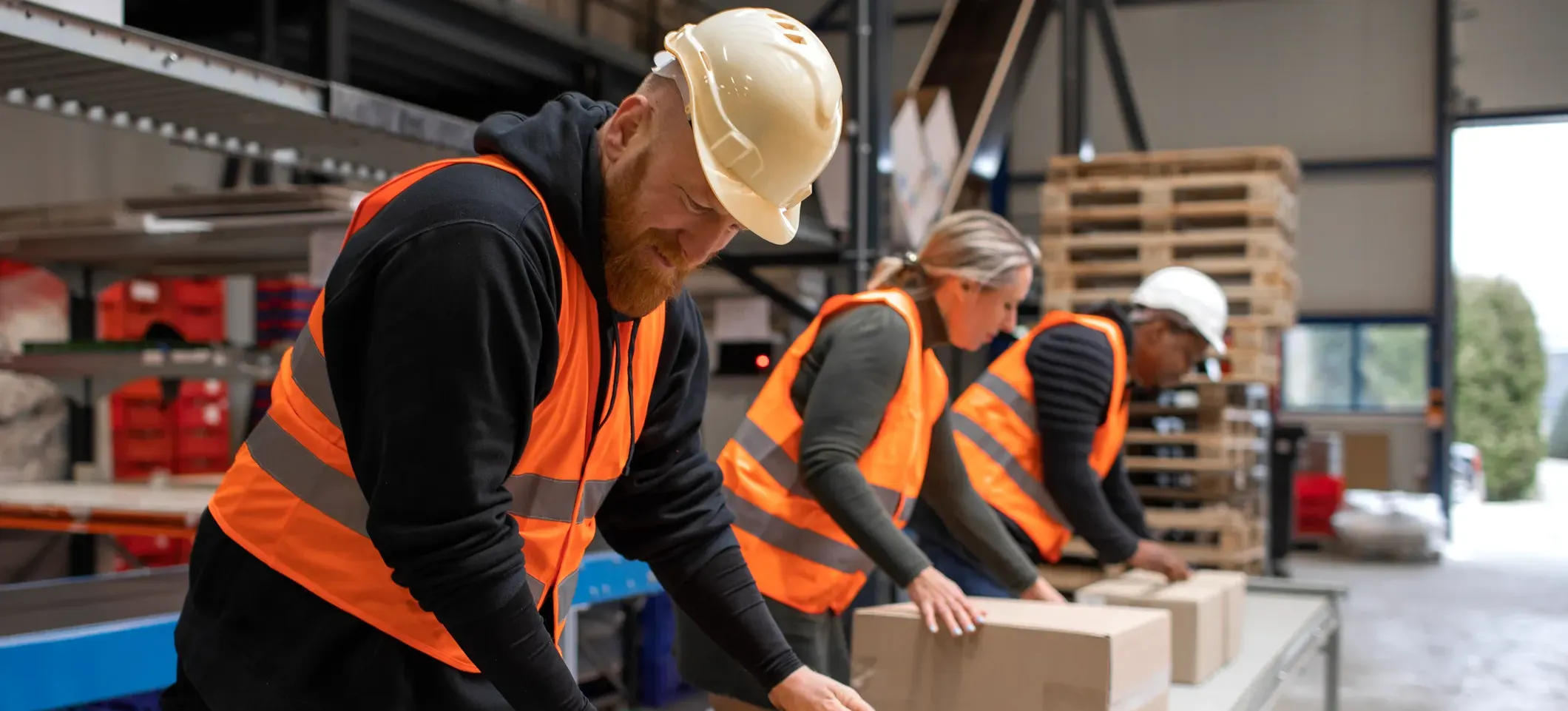 [Featured image]: Employees working on a line in a warehouse use Little's Law to calculate how many boxes they must move per hour.
