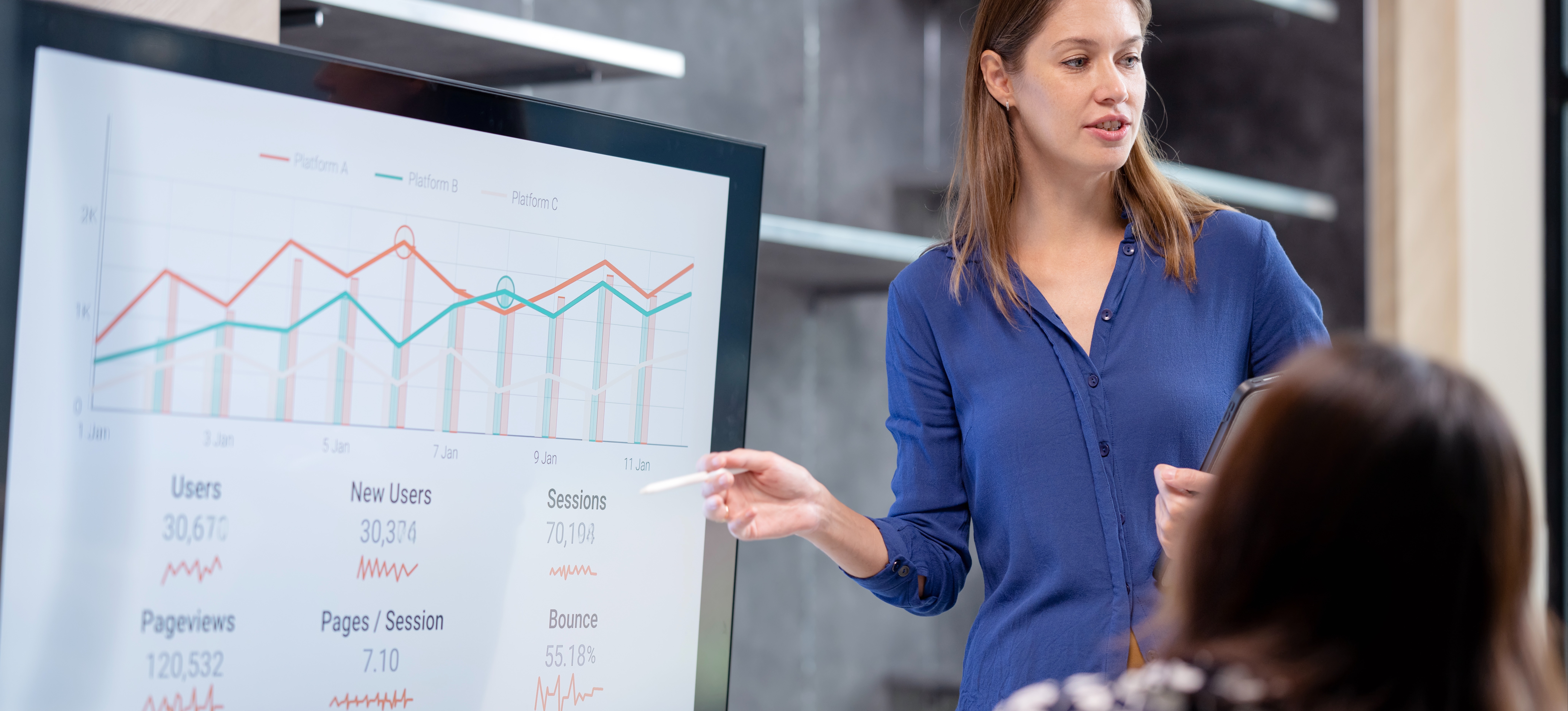 [Featured Image] A worker who learned how to become a project manager without a degree shares some data with their team. 