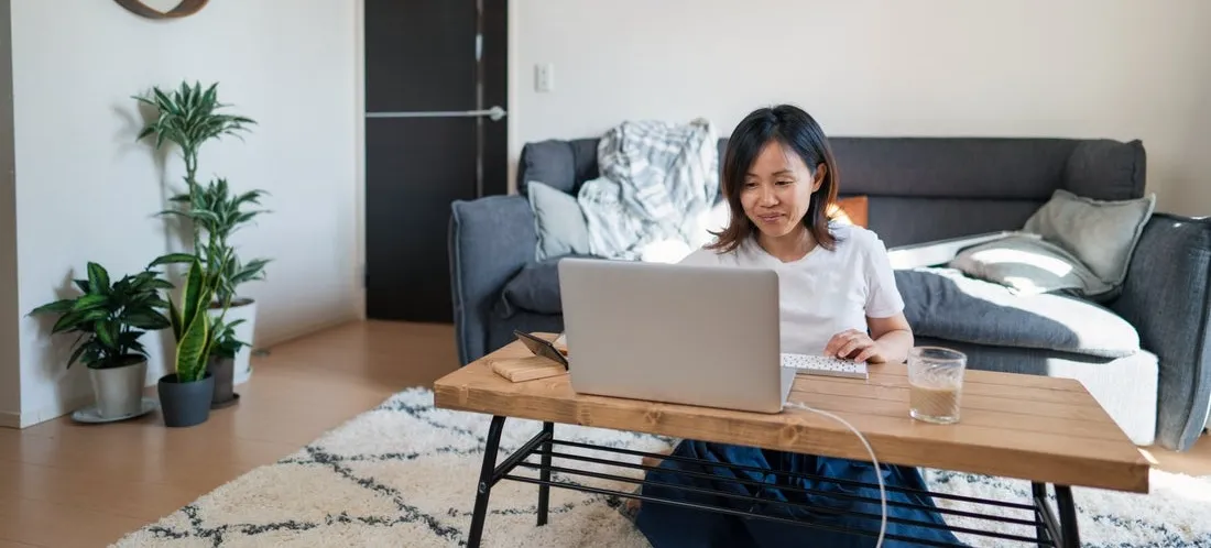 [Featured image] A person sits at their desk using the Array Formula in Google Sheets.