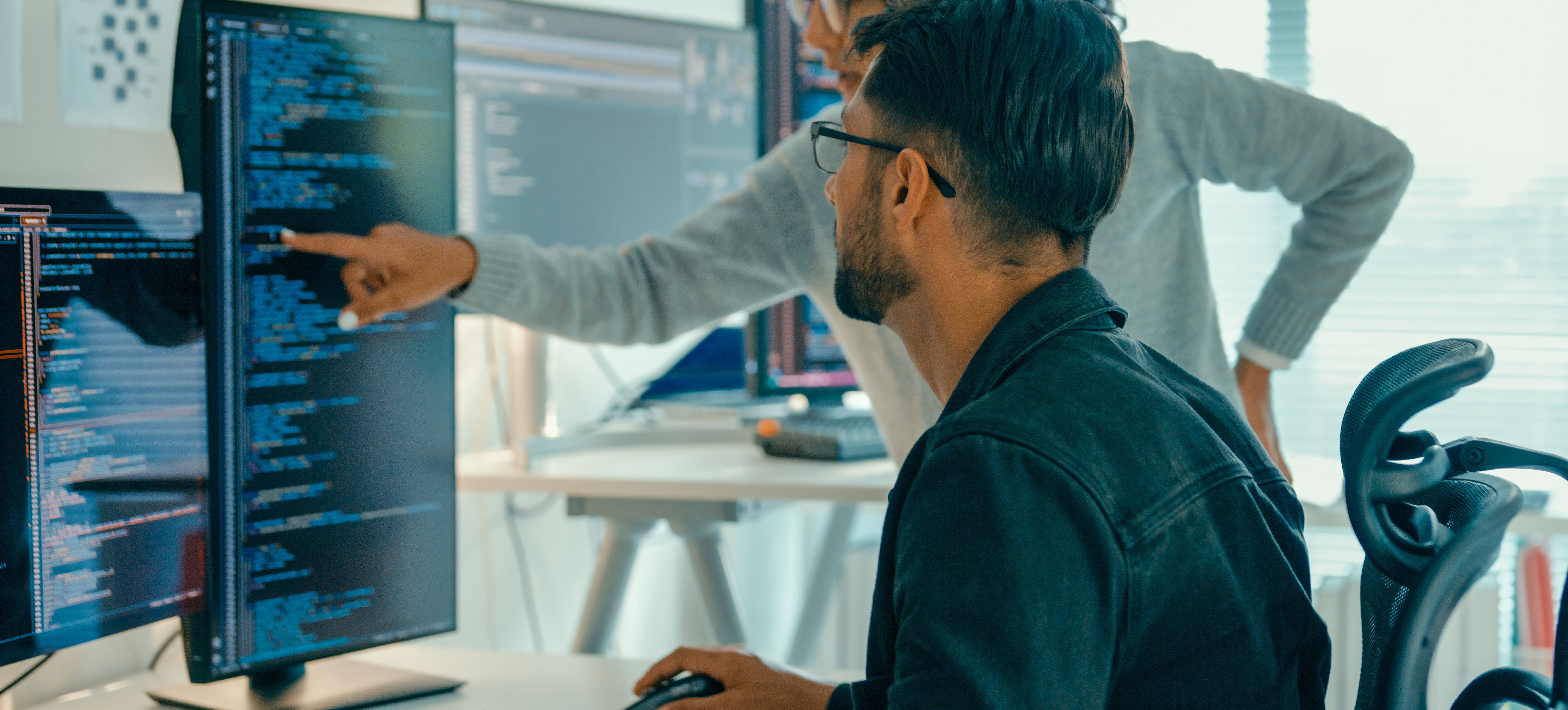 [Featured Image] Two software developers use Microsoft Stack services for cloud computing and data analytics.
