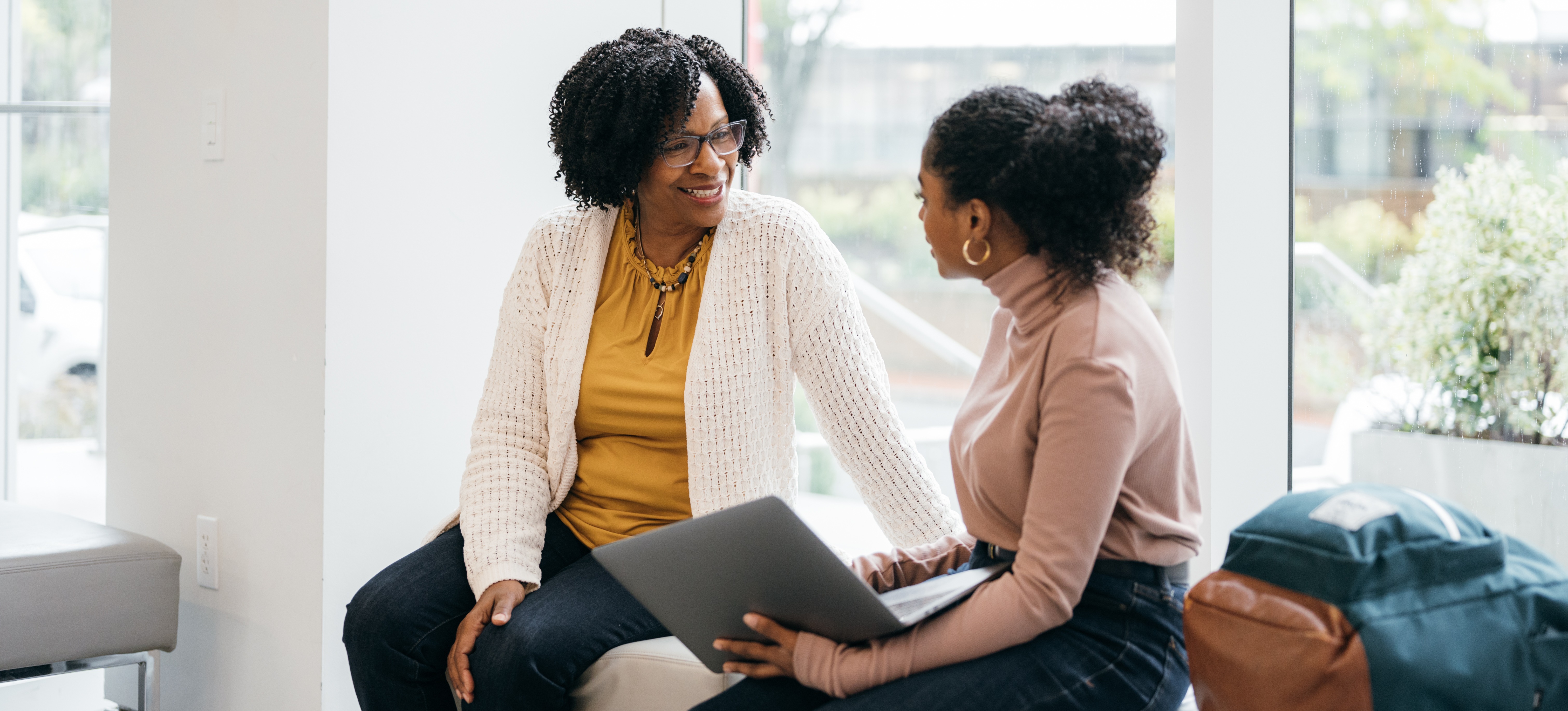 [Featured Image] A mentor and student are having a discussion about the student's future. 