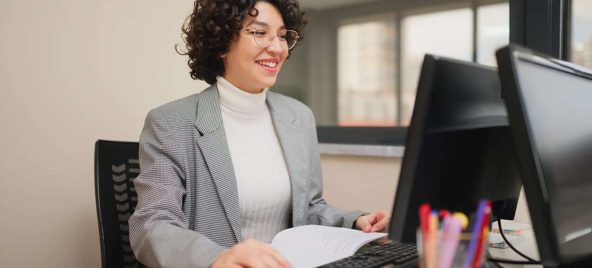 [Feature Image] A finance professional researches how to learn AI for accounting and finance on their computer.