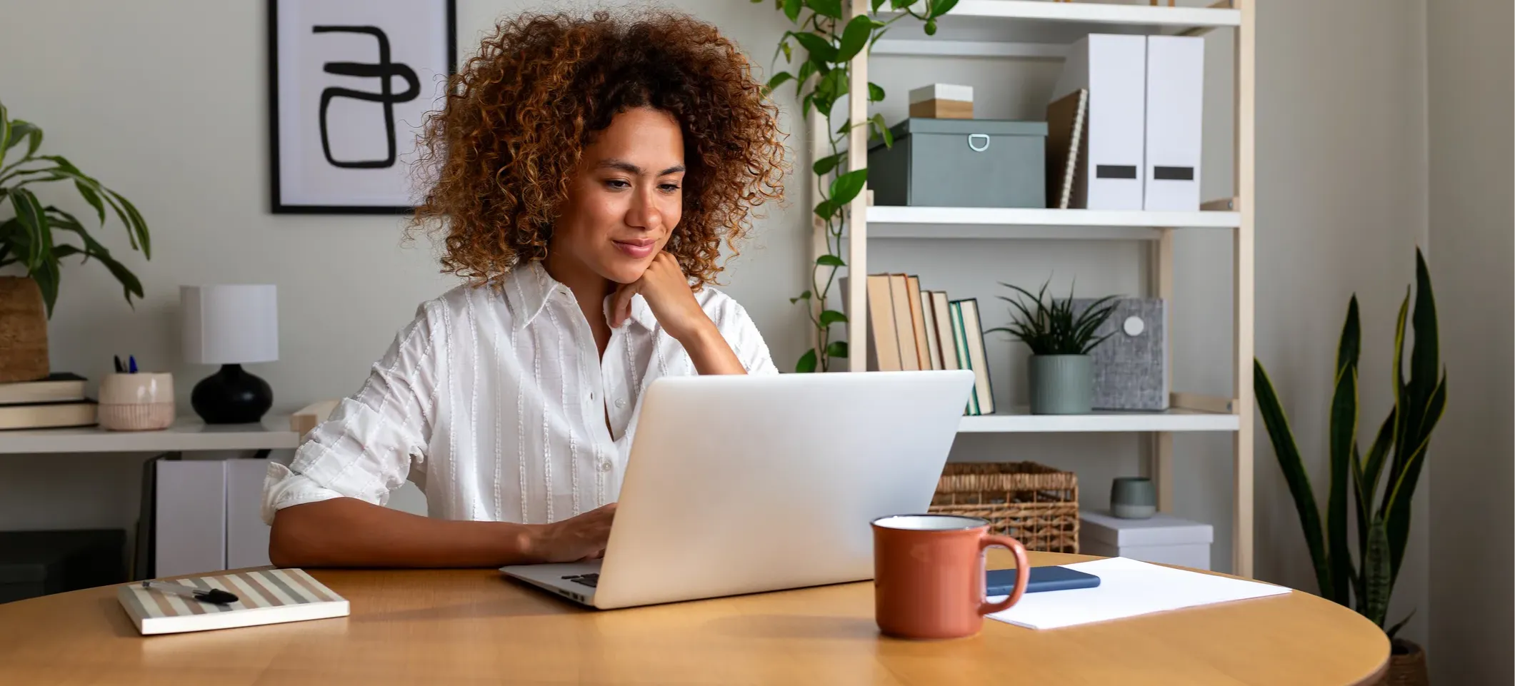 [Featured Image]: A person working on a laptop uses ChatGPT as a career coach to explore career paths.
