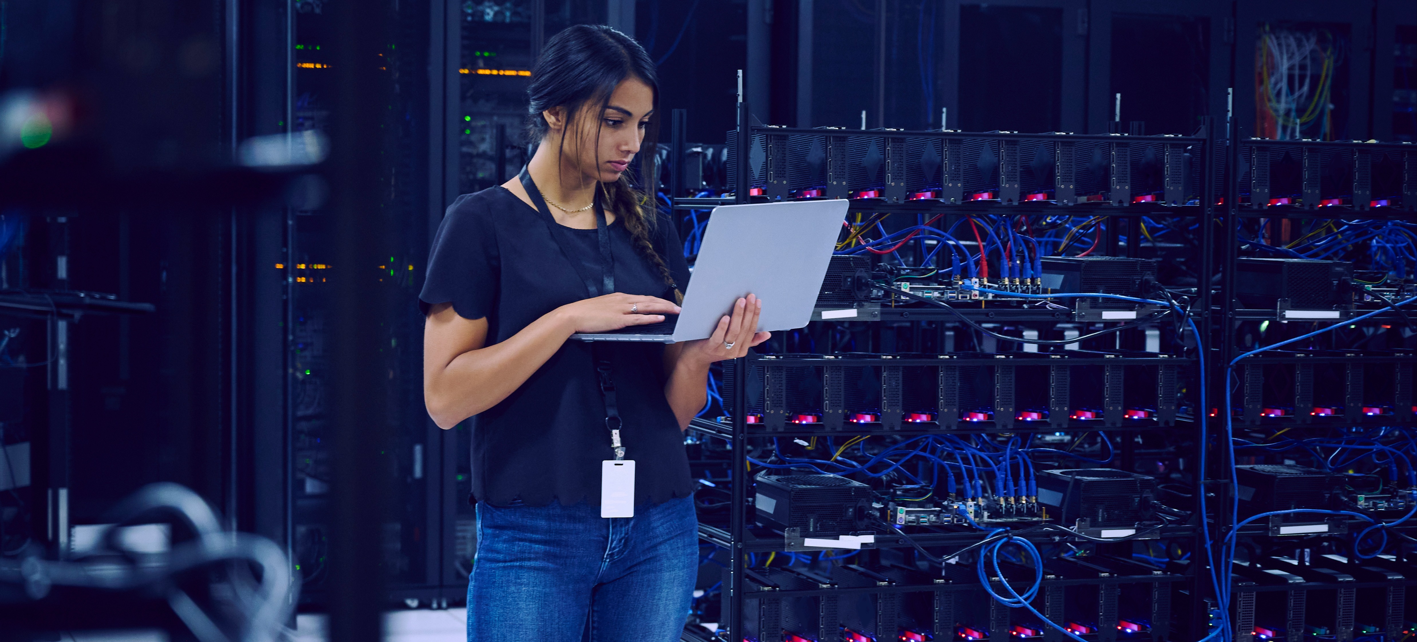 [Featured image]: A person uses a laptop to assess how well an organization protects its data, one of the roles of a cybersecurity or information security professional.
