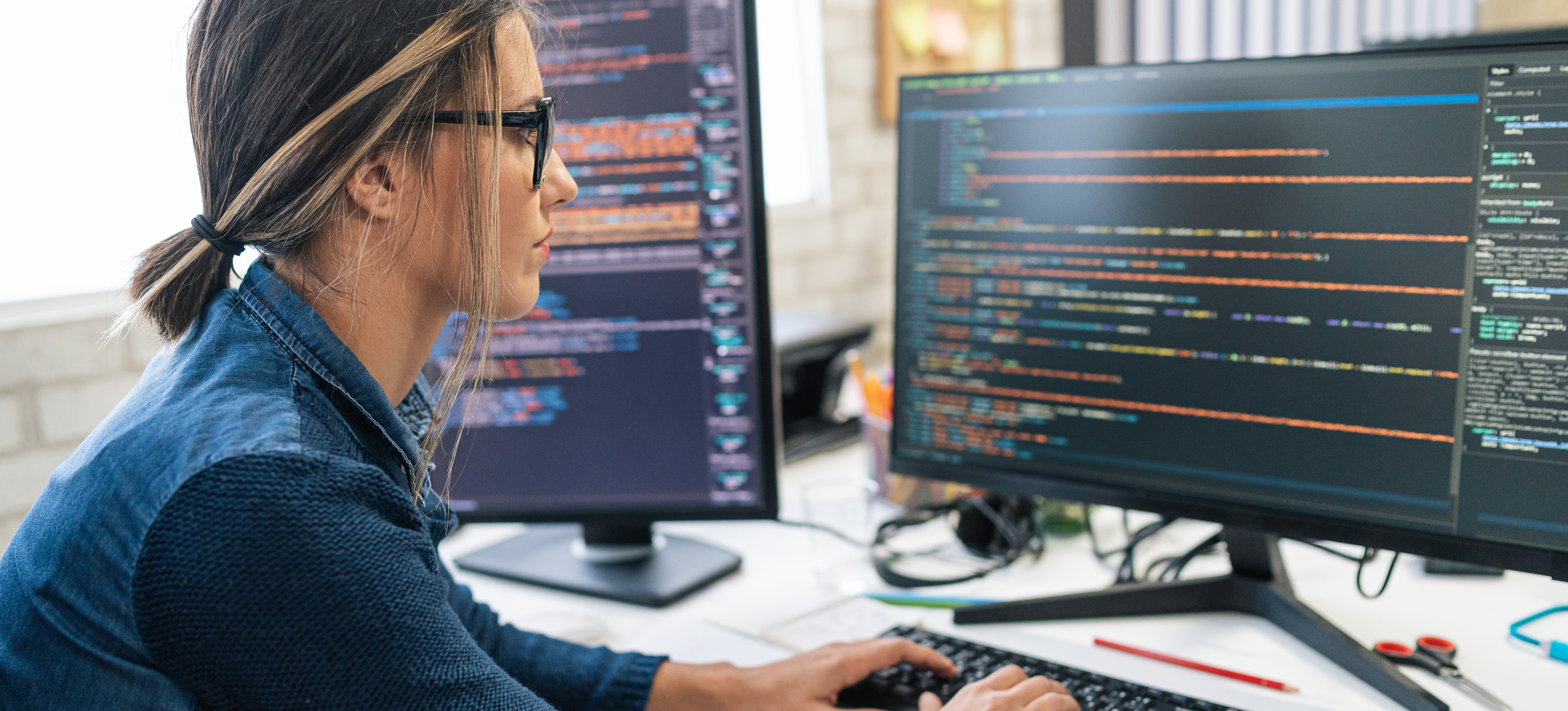 [Featured Image] A tech professional working on network security, representing the implementation of NSG rules to control traffic flow and protect cloud resources.
