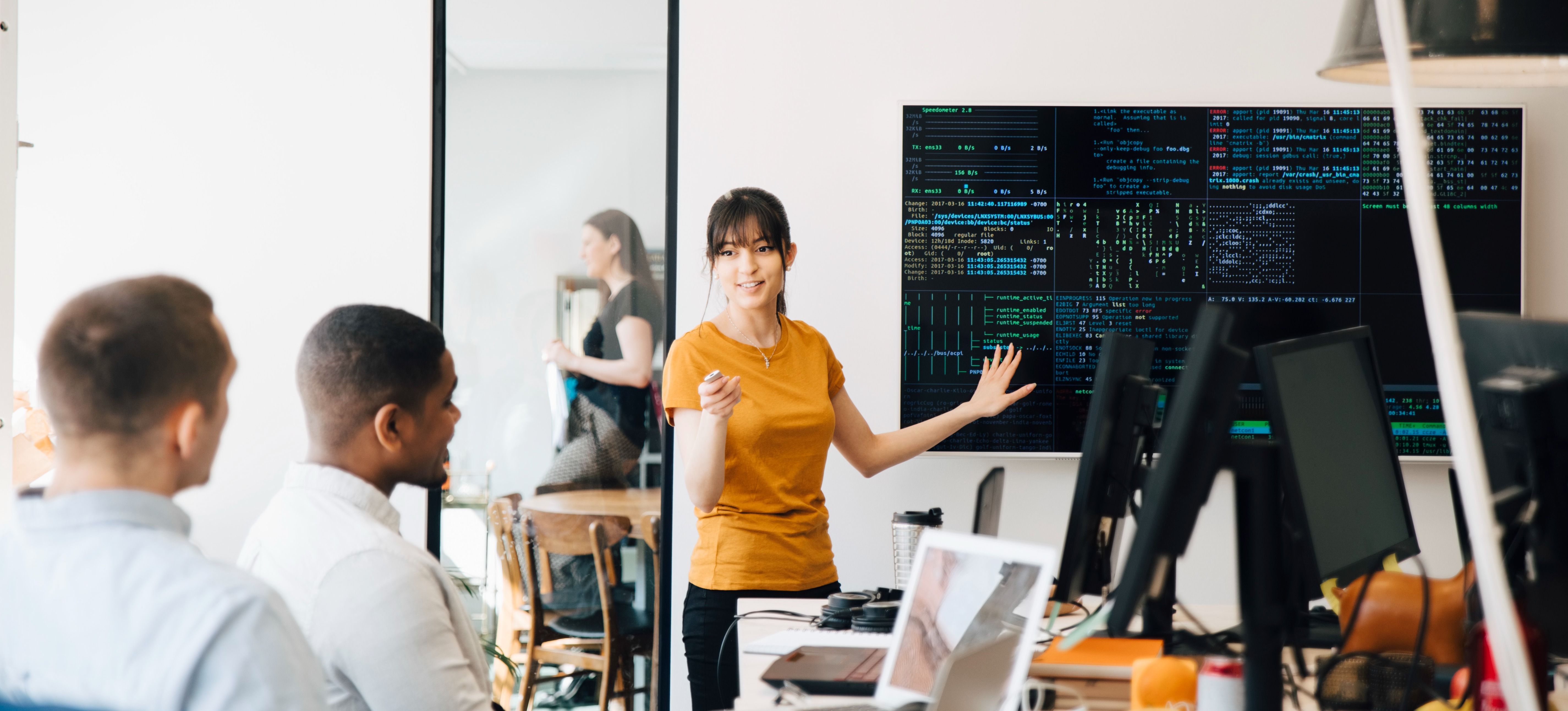 [Feature Image] An instructor explains low rank adaptation to a room of learners. 
