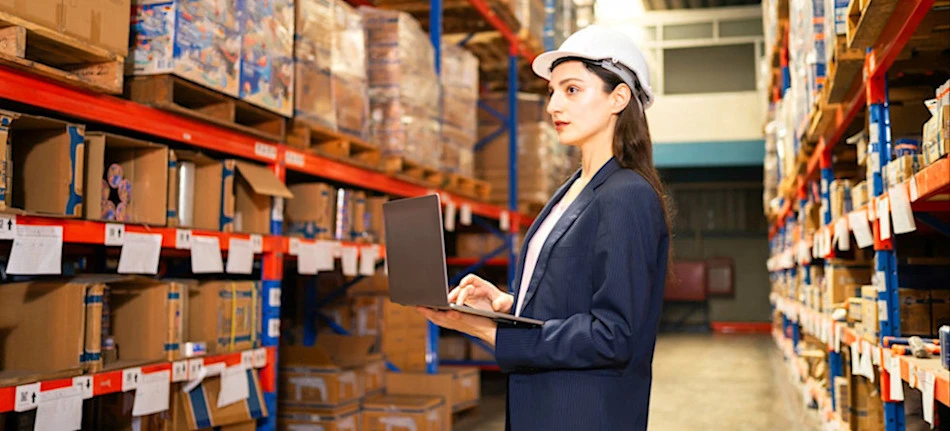 [Featured Image] A warehouse manager uses AI applications to help plan inventory.
