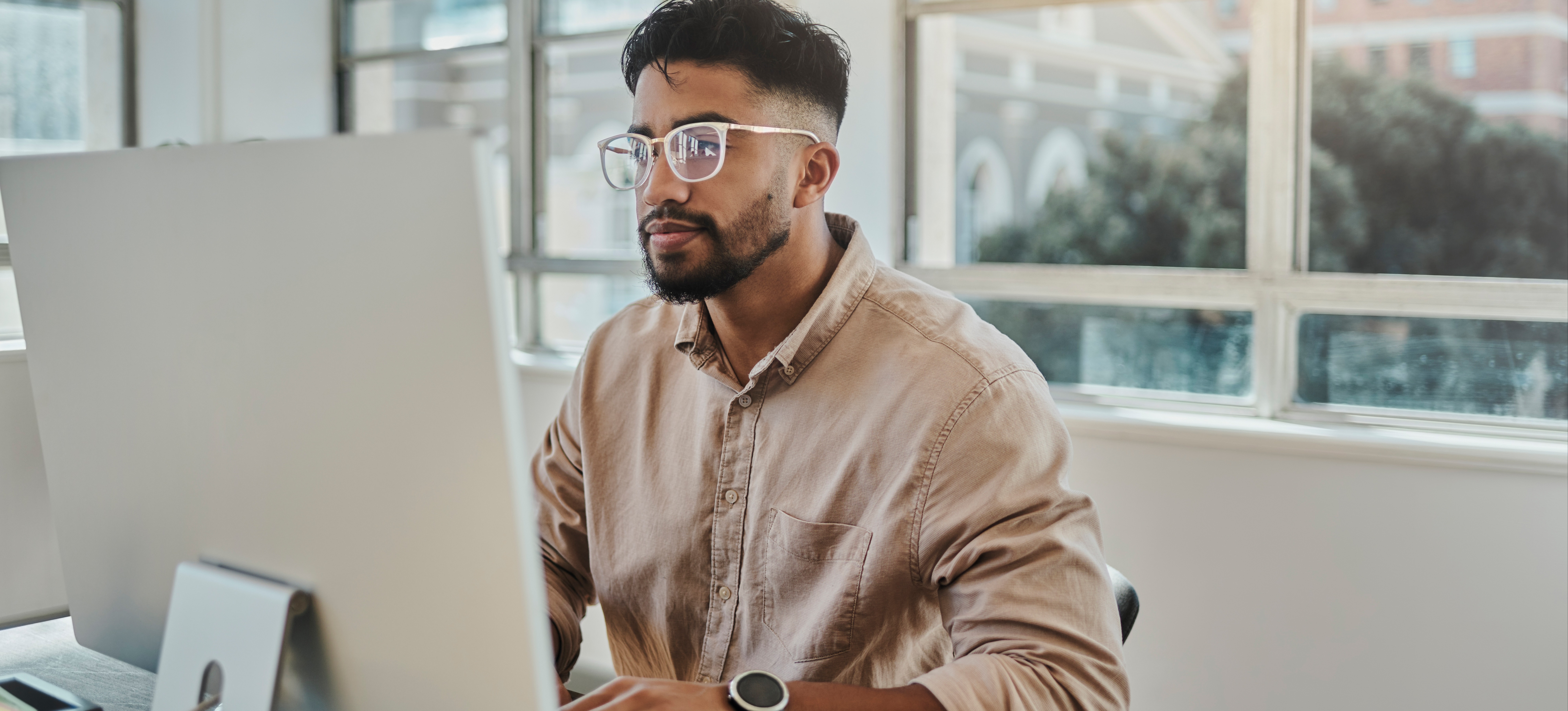 [Featured Image]: A person learns from a Python boot camp, where they learns how to code the programming language. 
