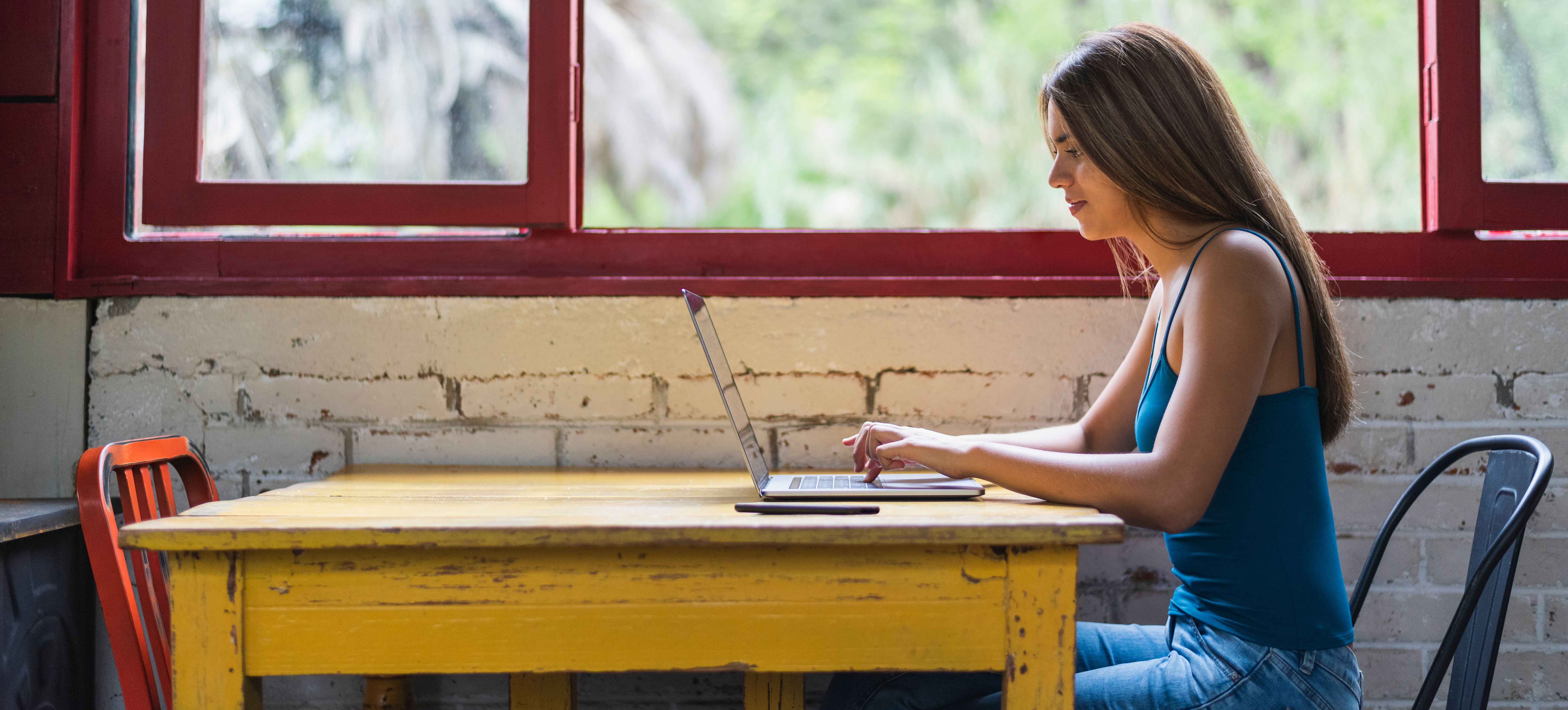 [Featured Image] A student studies for the SAT exam on their laptop.