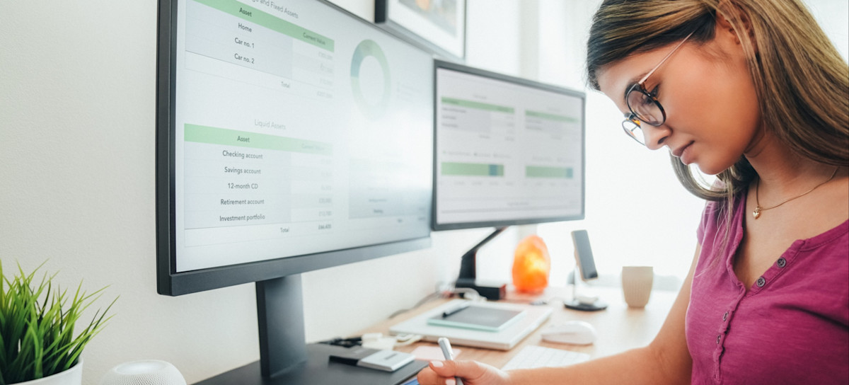 [Featured Image] An accounting learner reviews a journal entry example as part of their degree program.
