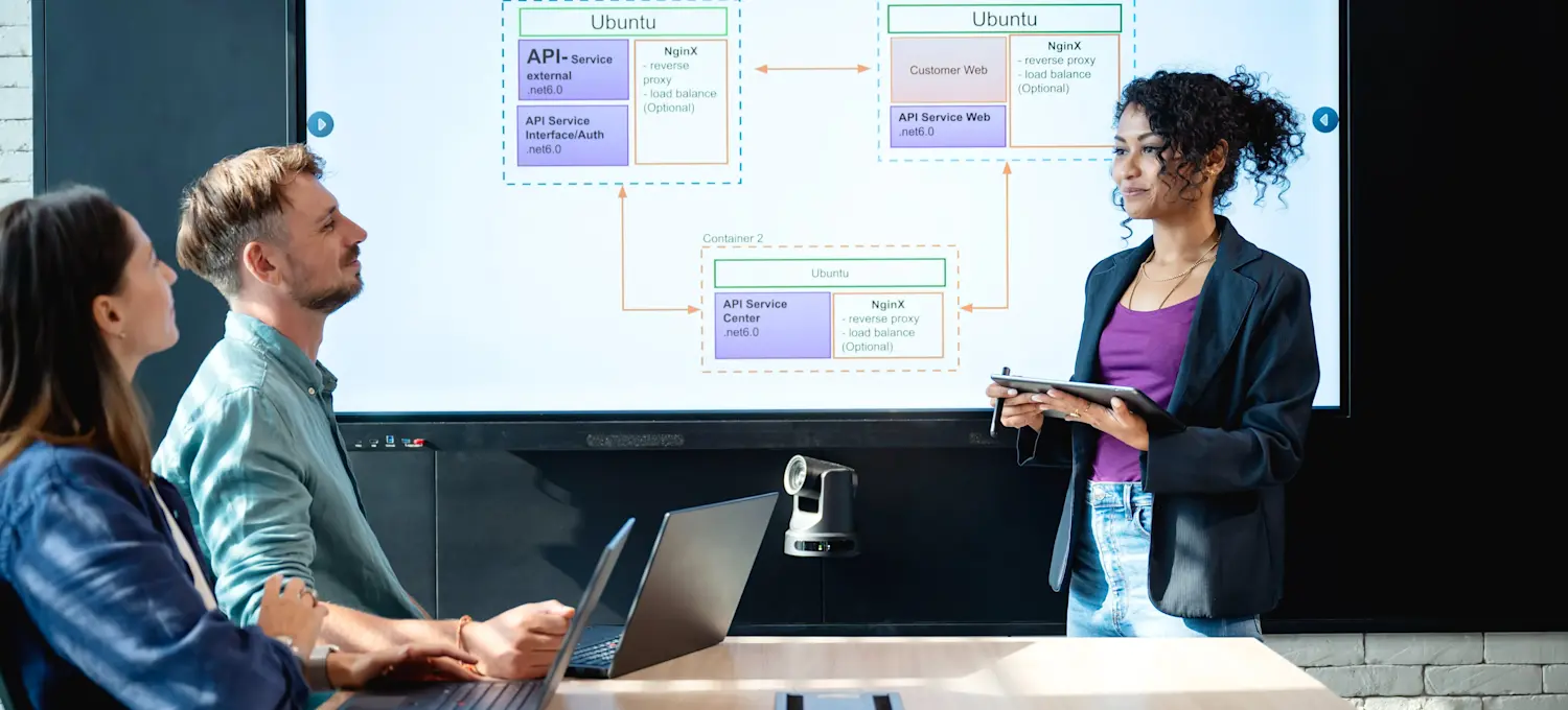 [Featured Image] A team of software developers discusses what Jira is and how to use it as a project management tool. 
