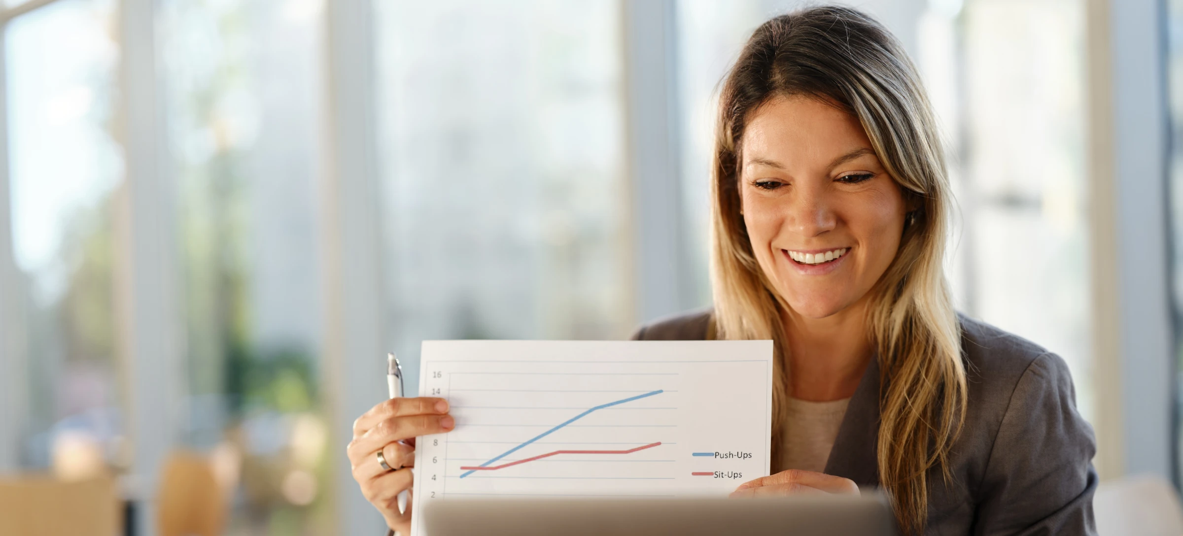 [Featured Image]  A business woman is on a zoom call presenting information gathered through google A/B testing.