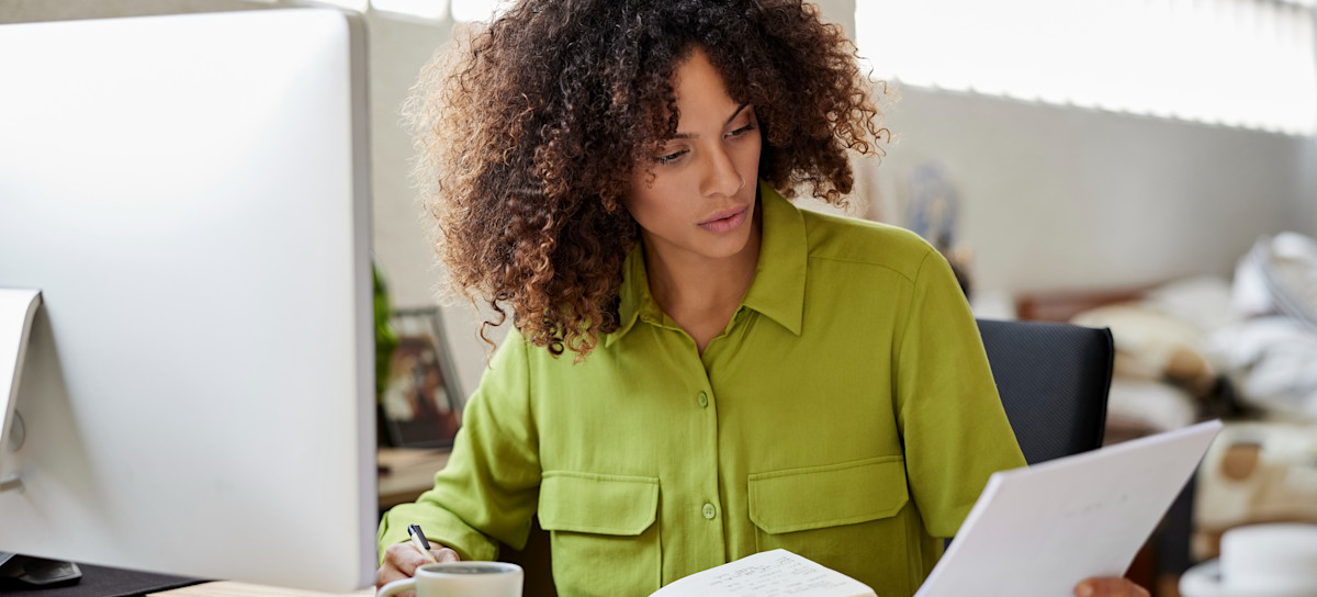 [Featured image] An accountant performs accumulated depreciation on a computer. 