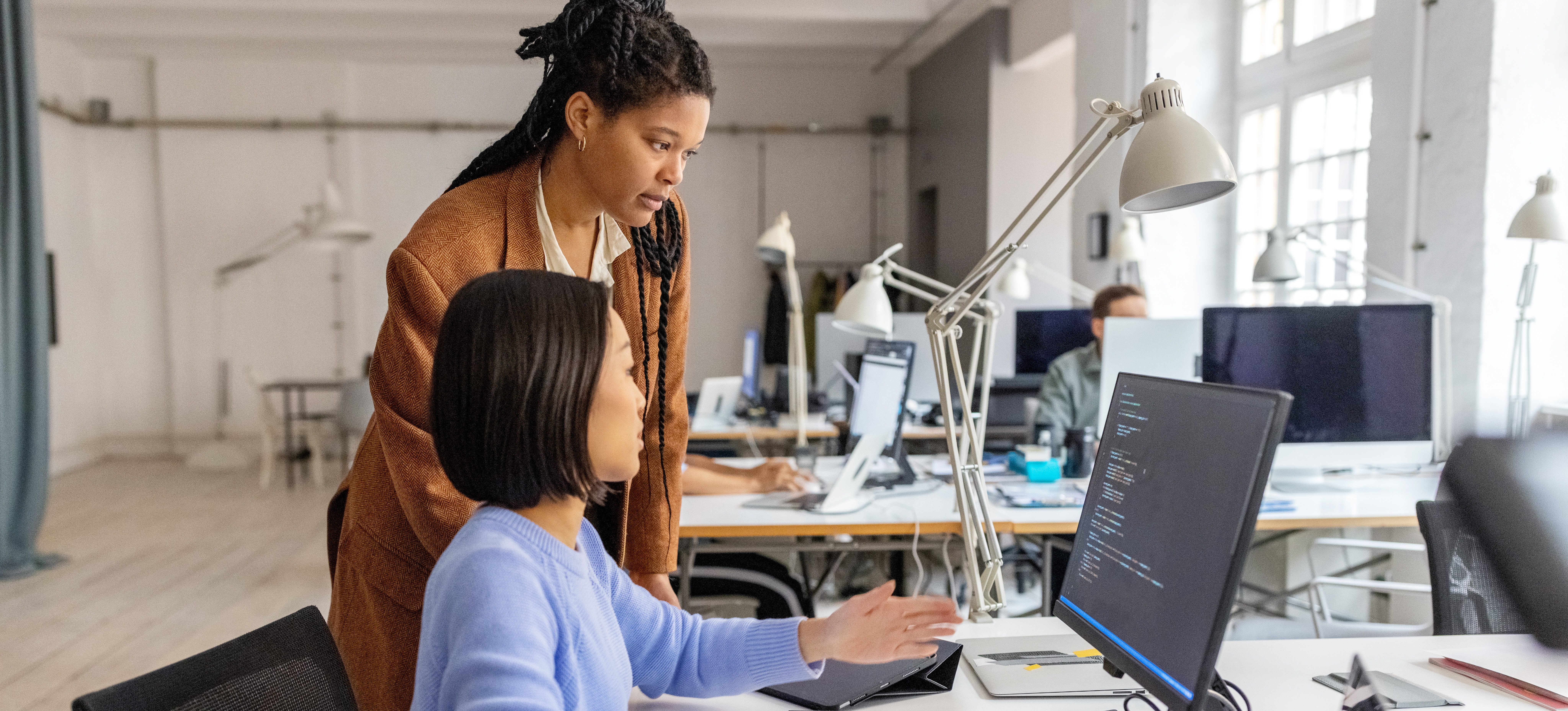 [Featured Image] Programmers discuss coding of neural network parameters and hyperparameters.
