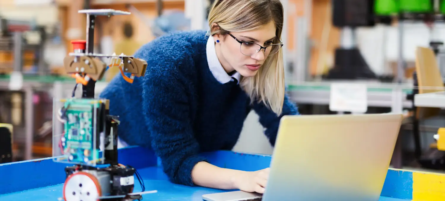 [Featured image] An electrical engineer works on a project with their laptop computer.