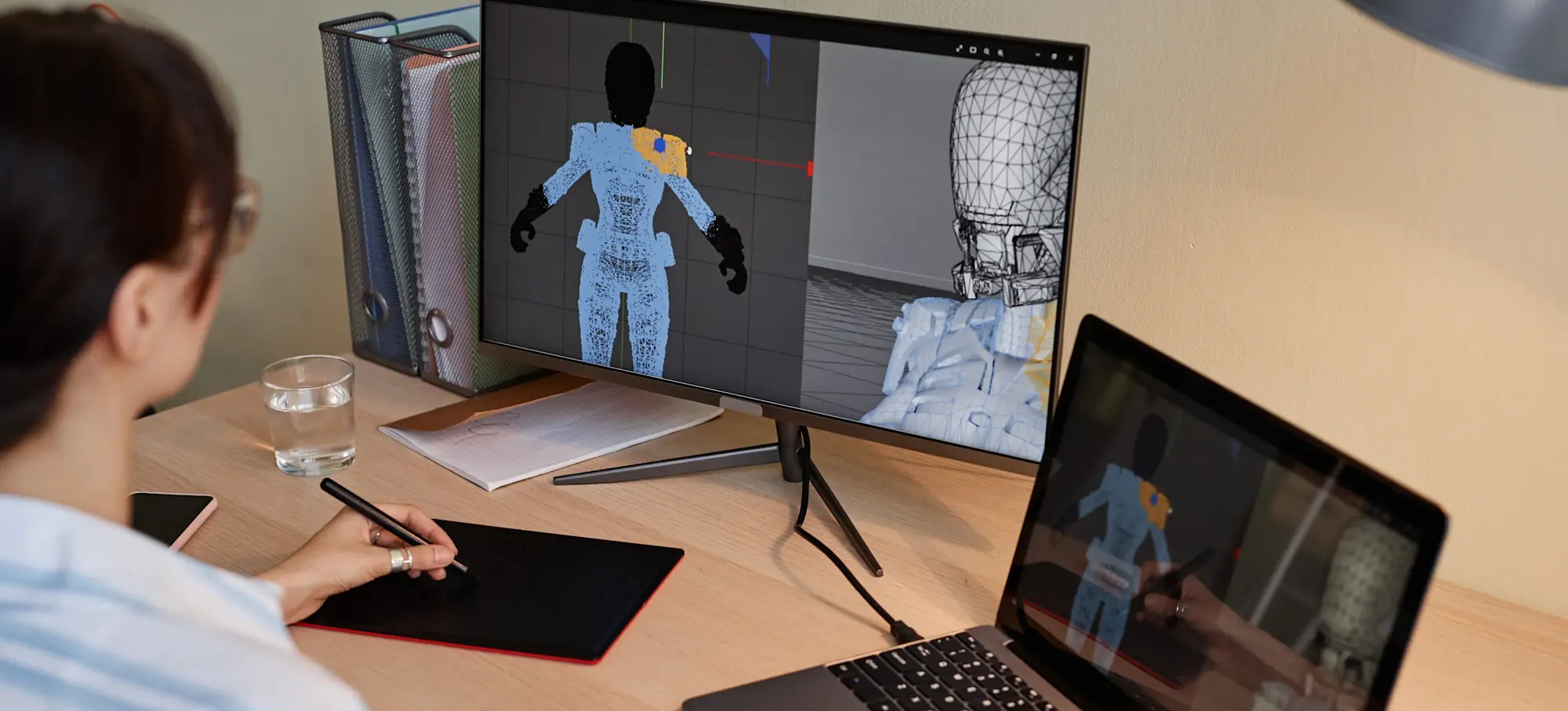 [Featured image]: After choosing a programming language to learn for game development, a video game designer creates a model of a character.
