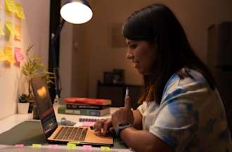 [Featured image] A learner is researching access control on their laptop. 