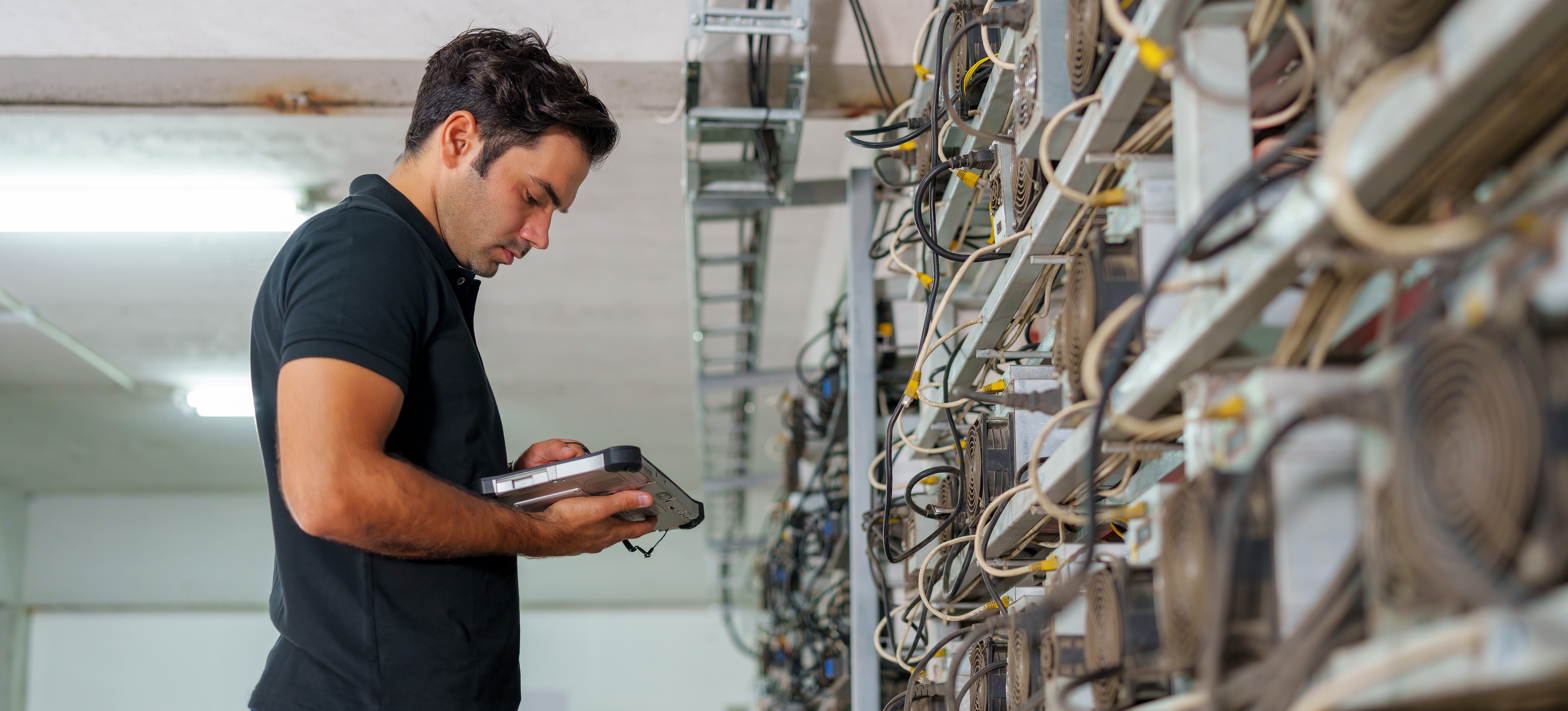 [Featured Image] A blockchain engineer is checking the network integration and security of a software.