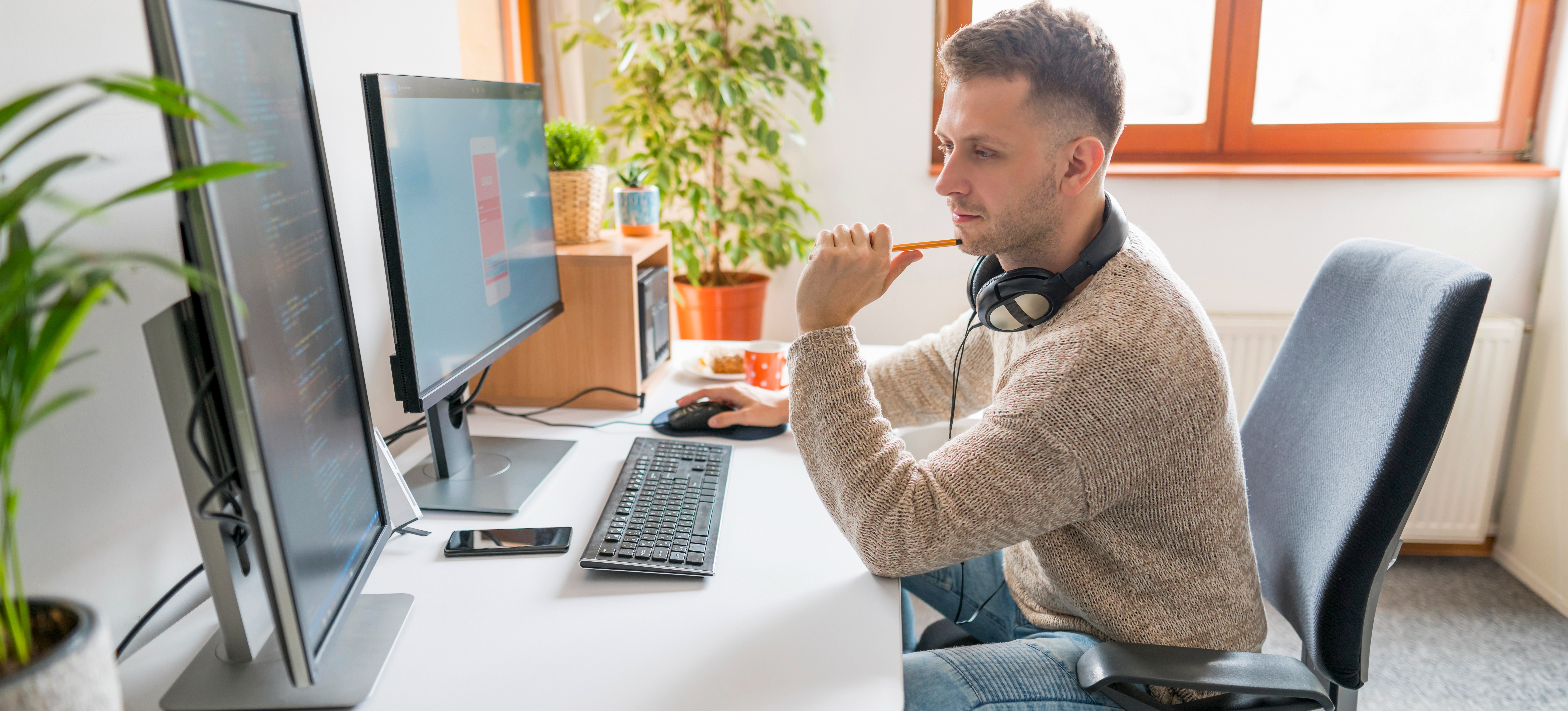 [Featured image] A man is learning how to become a software developer without a degree on his computer.
