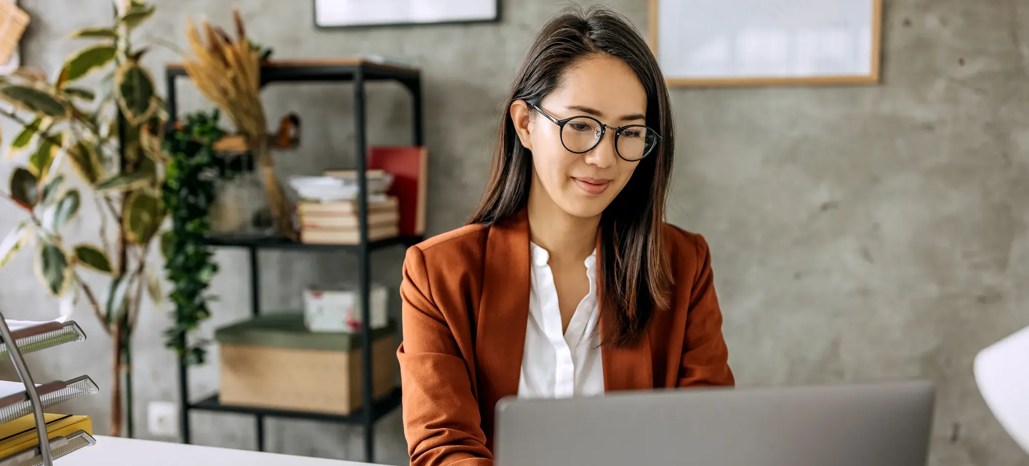 [Featured Image]: A person working on a laptop uses ChatGPT keyboard shortcuts to navigate the app.
