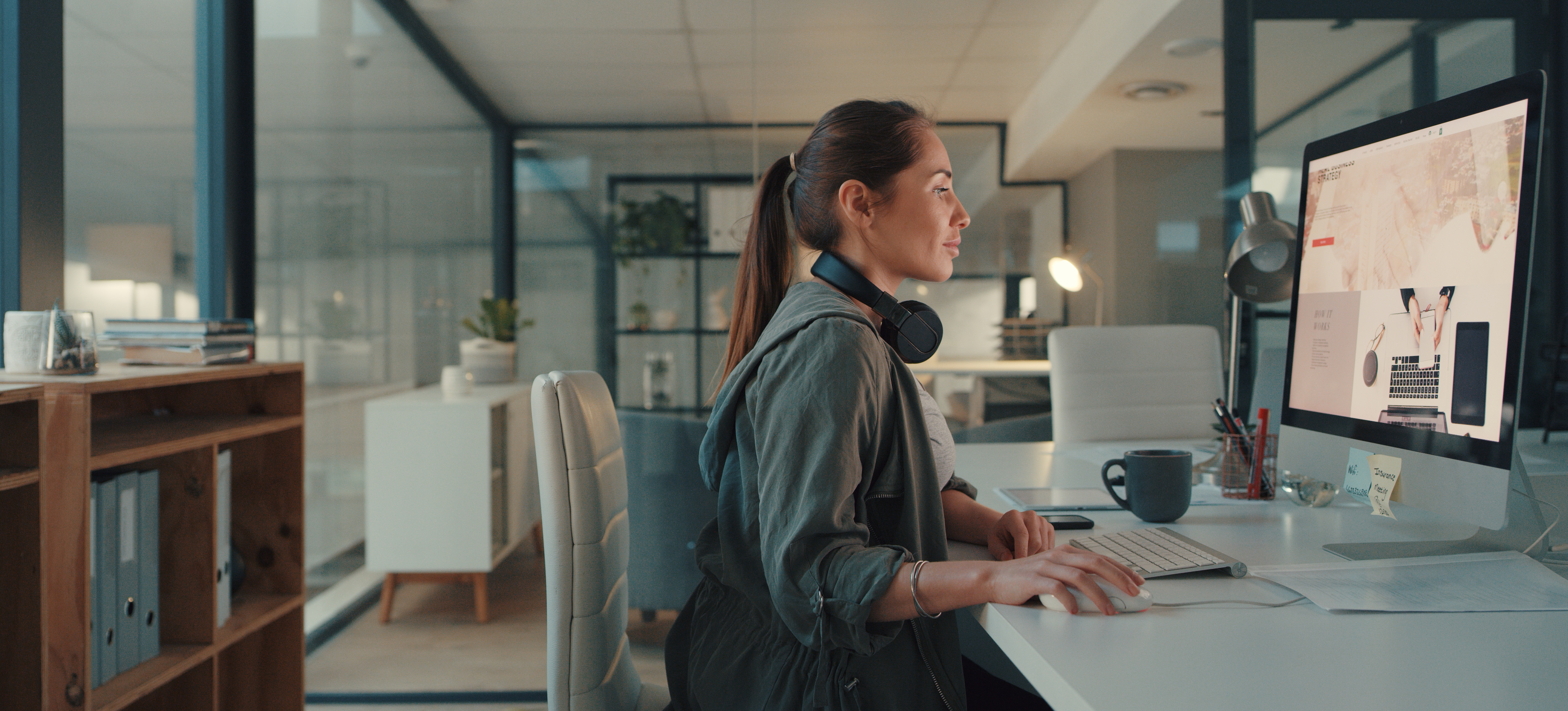[Featured image] A website designer works on a website mockup on their desktop computer.
