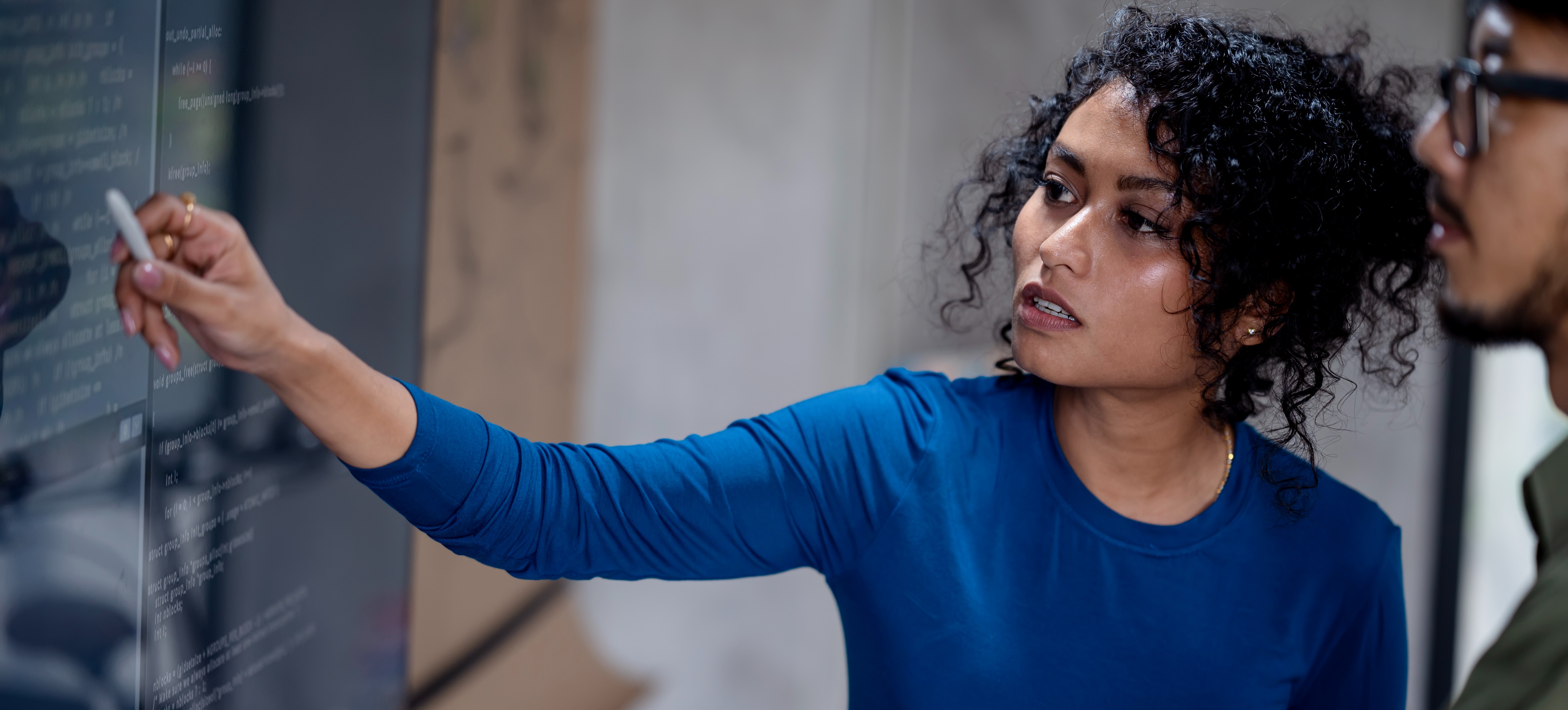 [Featured Image] Two data analysts discuss how a recent big data analysis can improve decision making for their business.
