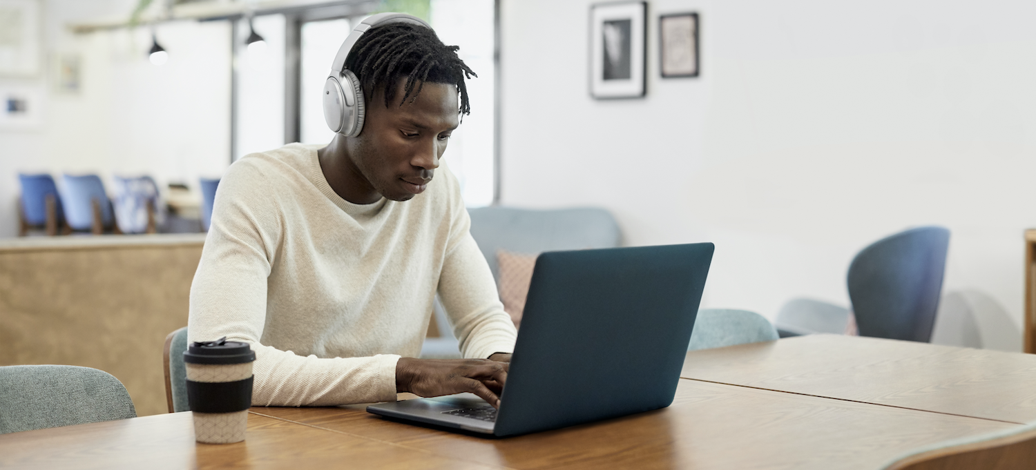 [Featured image] An ethical hacker works from home on their laptop.