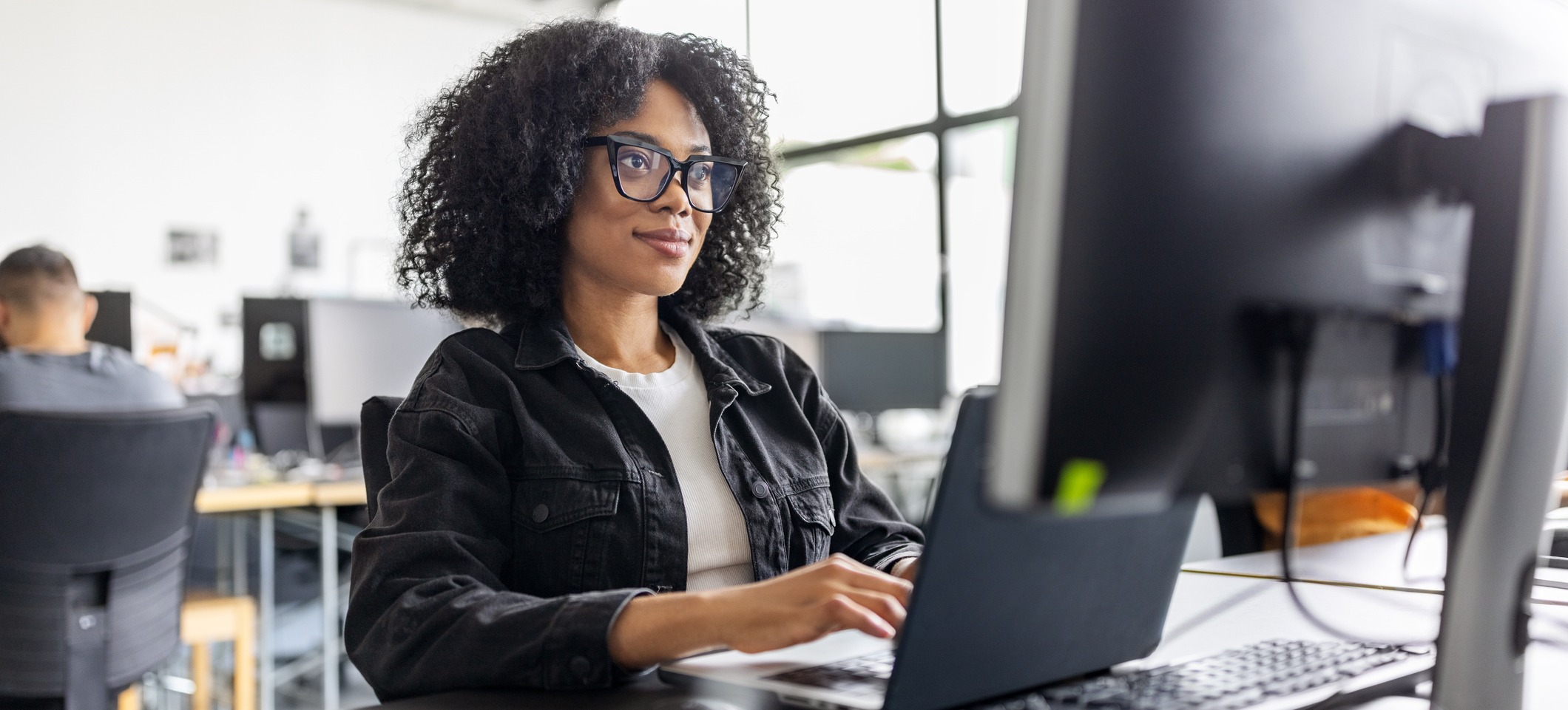 [Featured Image]: A person uses a laptop to search for index seek versus index scan to learn more about database development and management.
