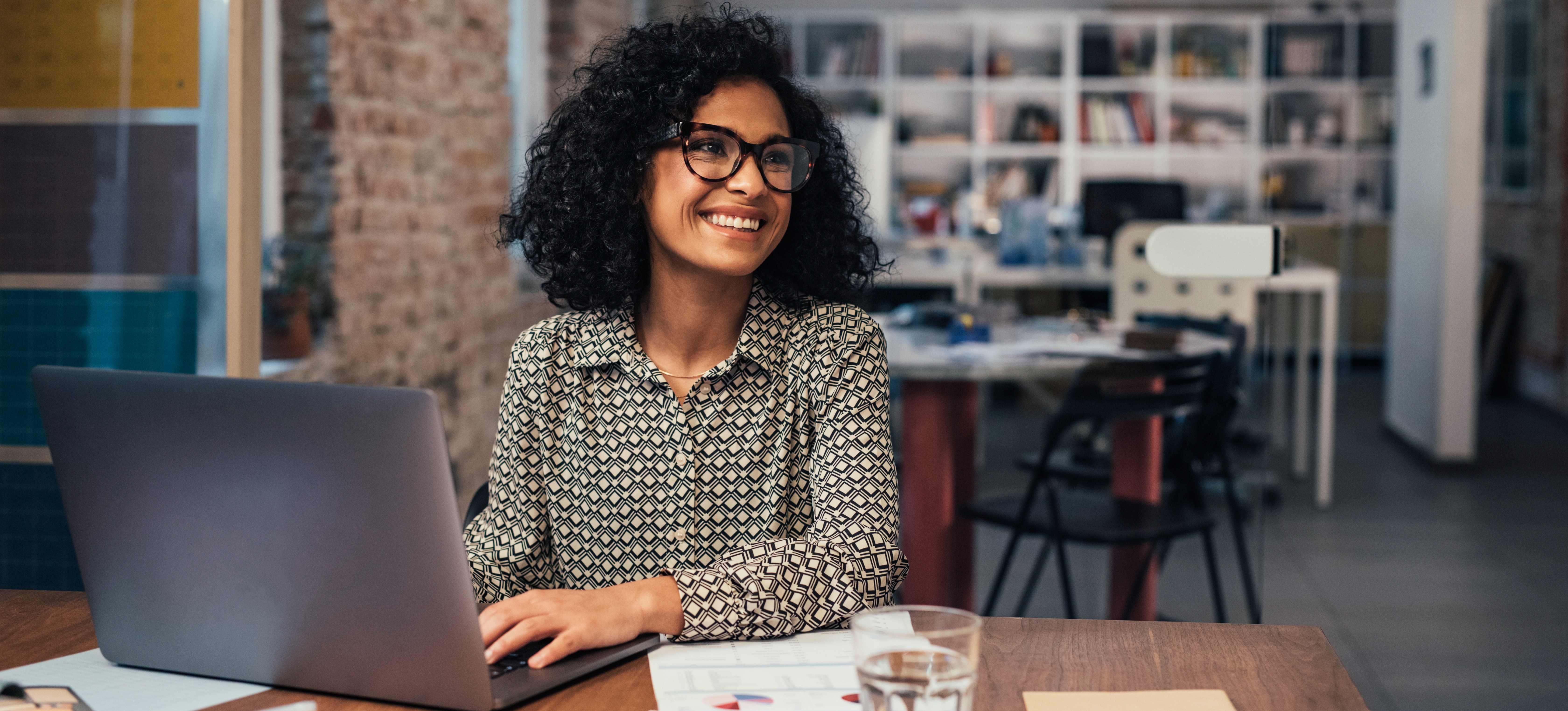 [Feature Image] A deep learning professional wearing dark-rimmed glasses considers whether TensorFlor or PyTorch would be more suitable for their project.
